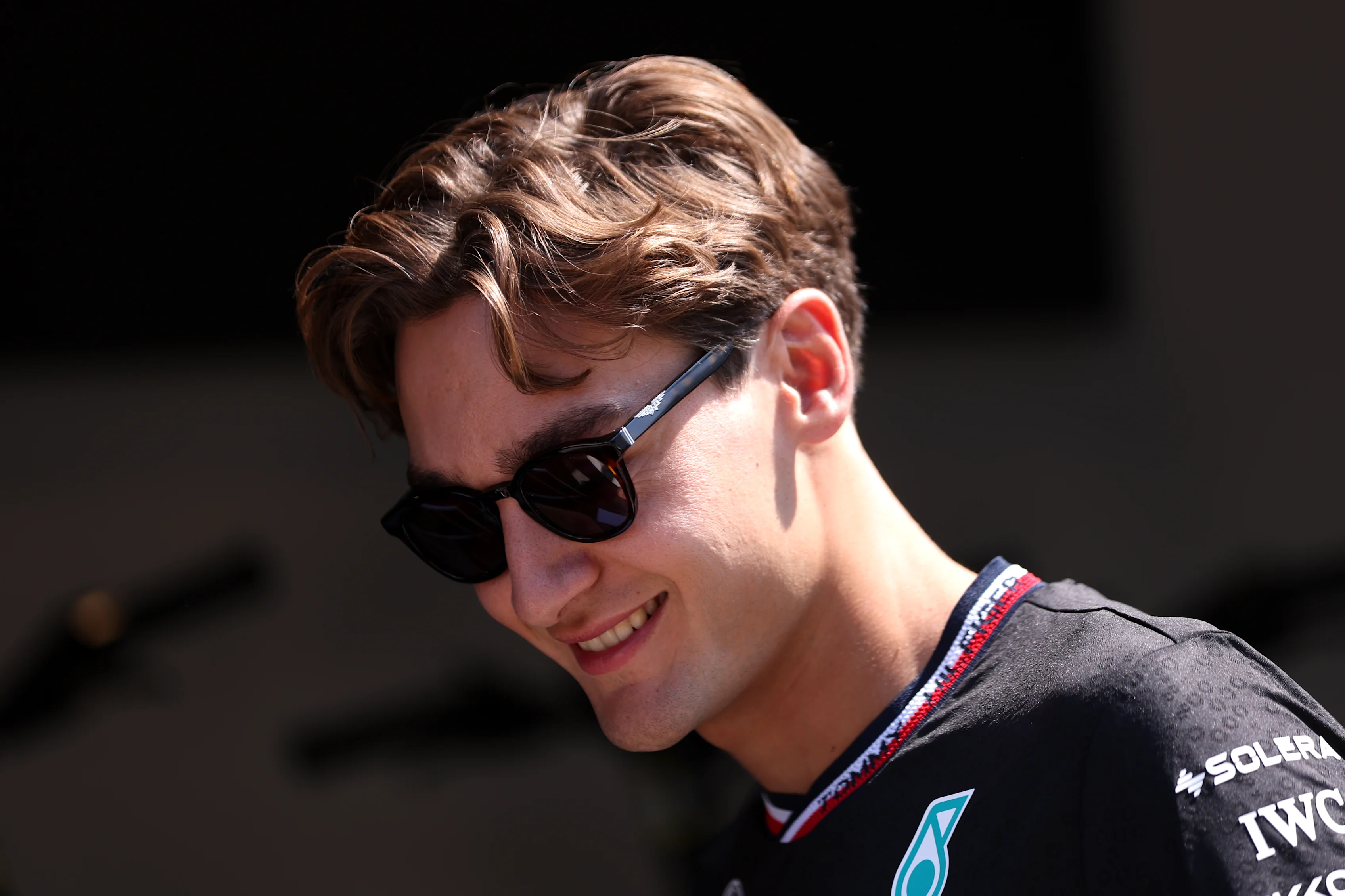 BUDAPEST, HUNGARY - JULY 18: George Russell of Great Britain and Mercedes looks on in the Paddock