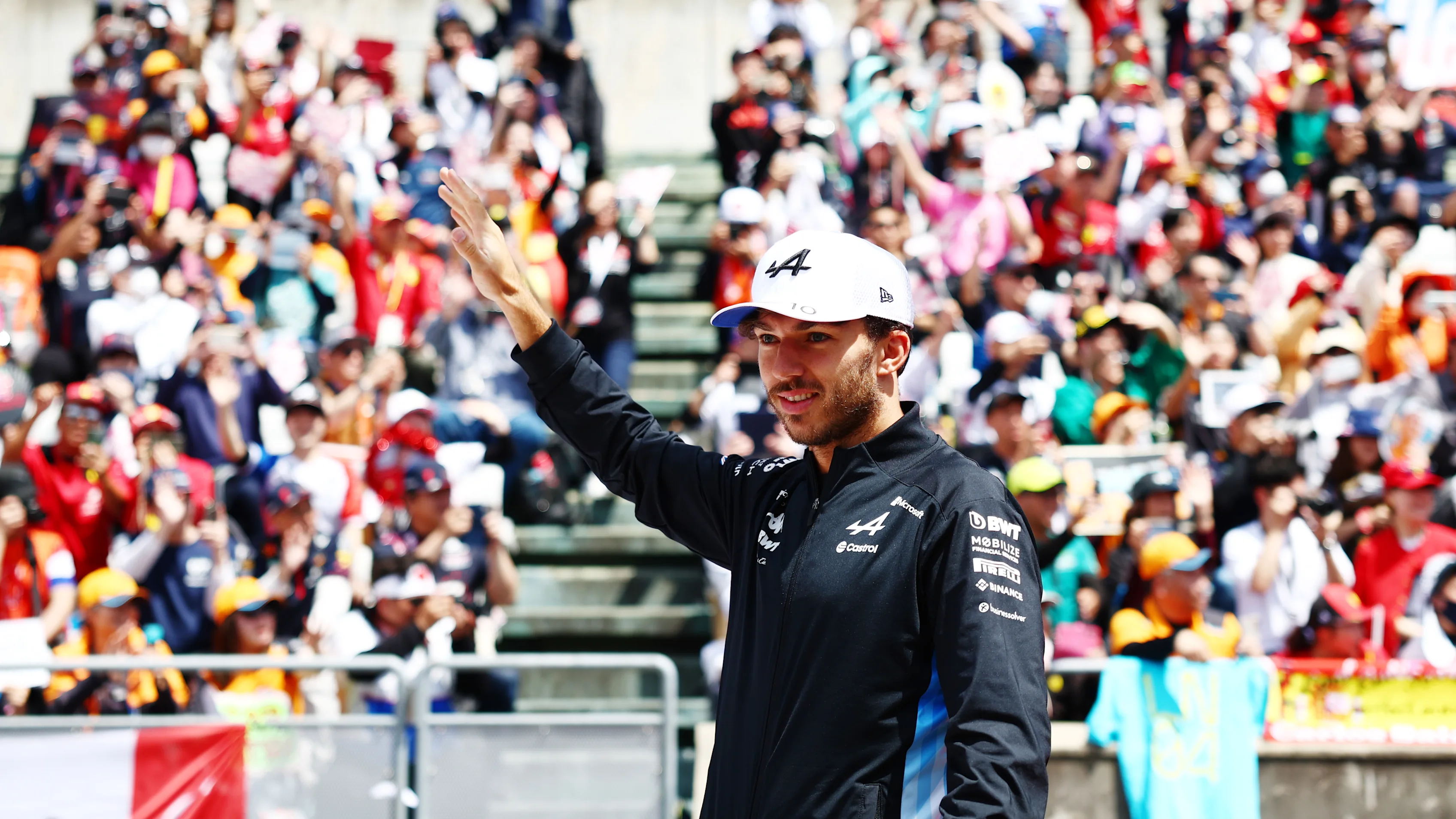 SUZUKA, JAPAN - APRIL 07: Pierre Gasly of France and Alpine F1 waves to the crowd on the drivers parade prior to the F1 Grand Prix of Japan at Suzuka International Racing Course on April 07, 2024 in Suzuka, Japan. (Photo by Bryn Lennon - Formula 1/Formula 1 via Getty Images)