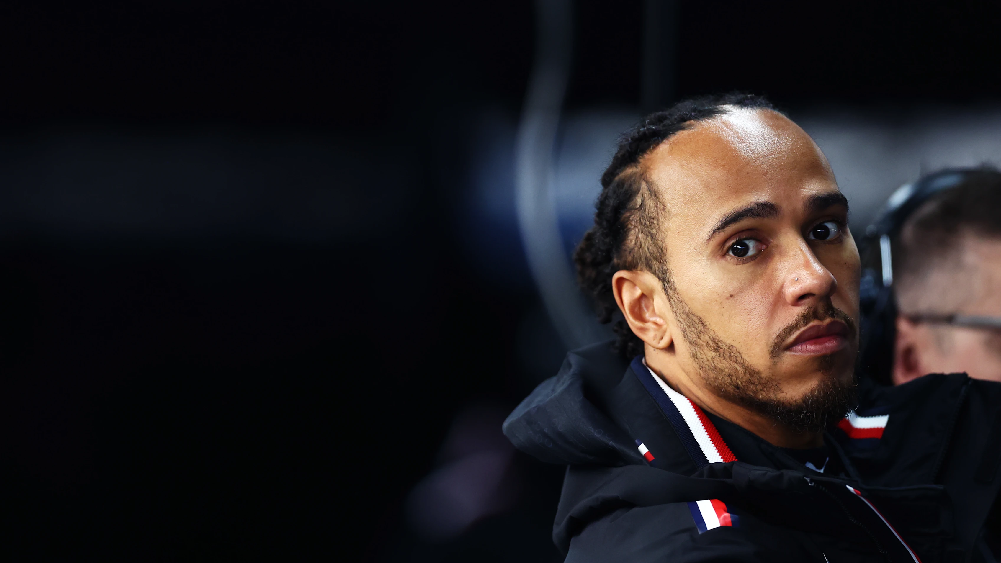 SUZUKA, JAPAN - APRIL 05: Lewis Hamilton of Great Britain and Mercedes looks on in the garage during practice ahead of the F1 Grand Prix of Japan at Suzuka International Racing Course on April 05, 2024 in Suzuka, Japan. (Photo by Bryn Lennon - Formula 1/Formula 1 via Getty Images)