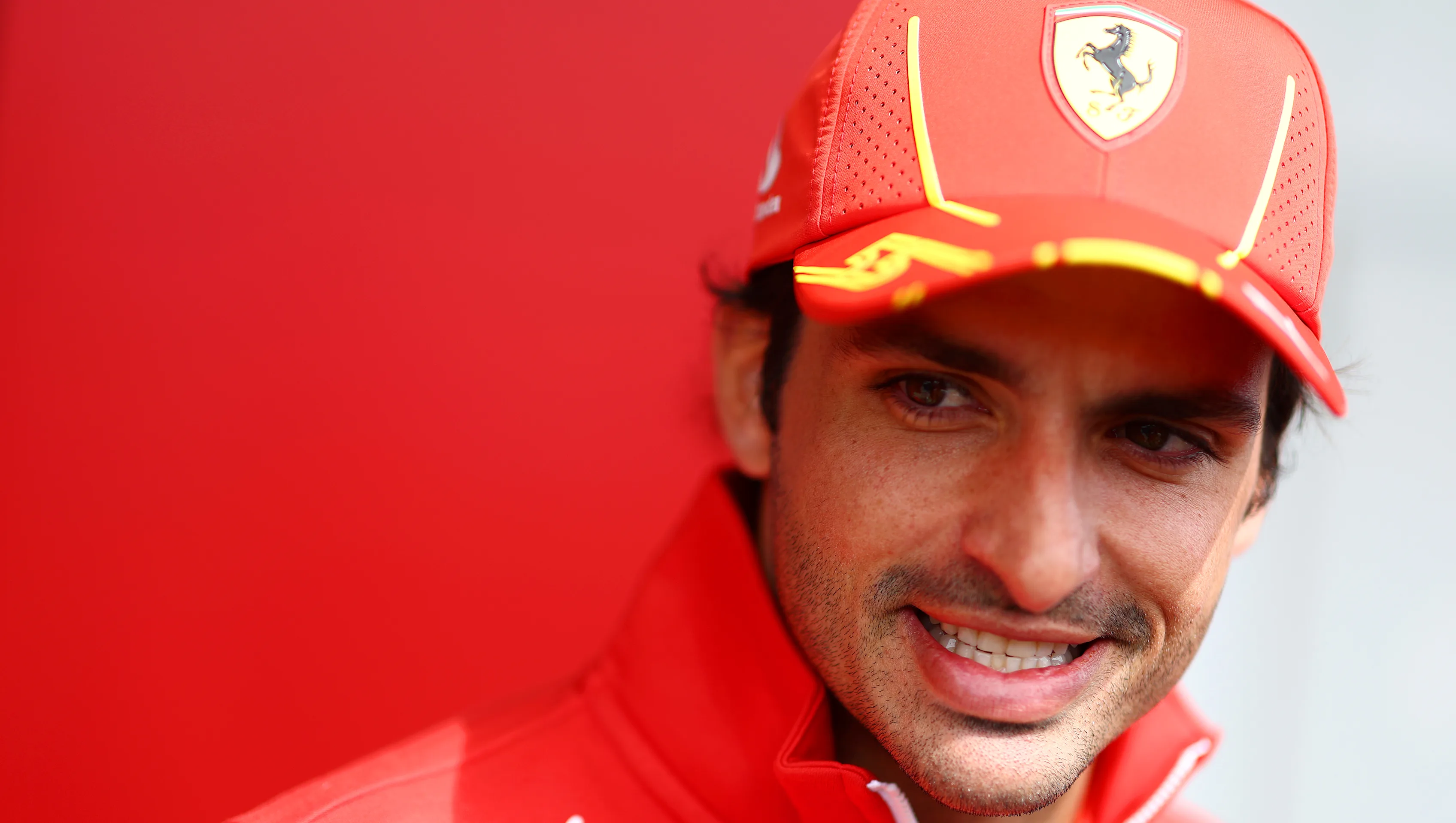 SUZUKA, JAPAN - APRIL 04: Carlos Sainz of Spain and Ferrari looks on in the Paddock during previews