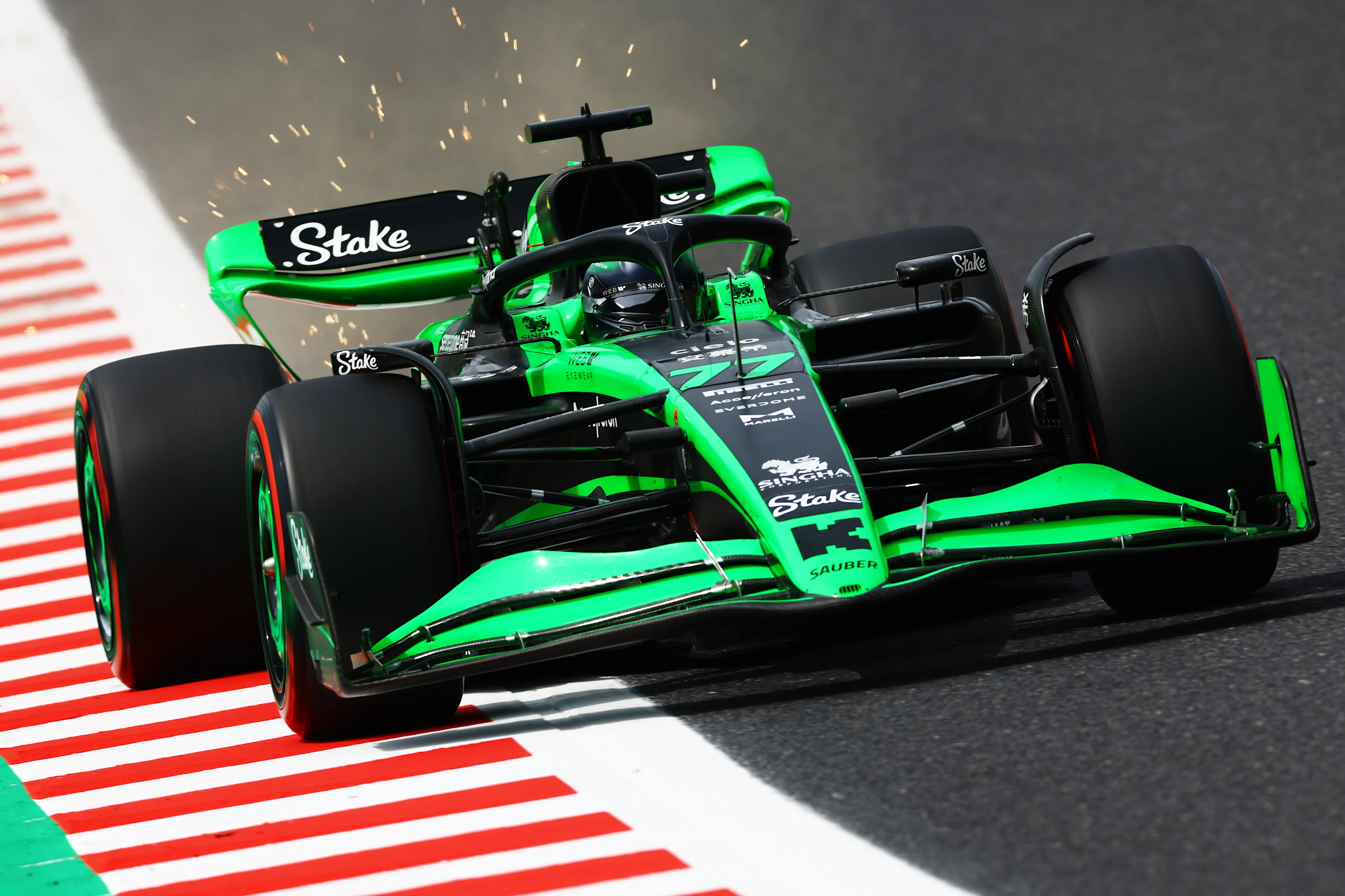 SUZUKA, JAPAN - APRIL 06: Sparks fly behind Valtteri Bottas of Finland driving the (77) Kick Sauber C44 Ferrari during final practice ahead of the F1 Grand Prix of Japan at Suzuka International Racing Course on April 06, 2024 in Suzuka, Japan. (Photo by Mark Thompson/Getty Images)