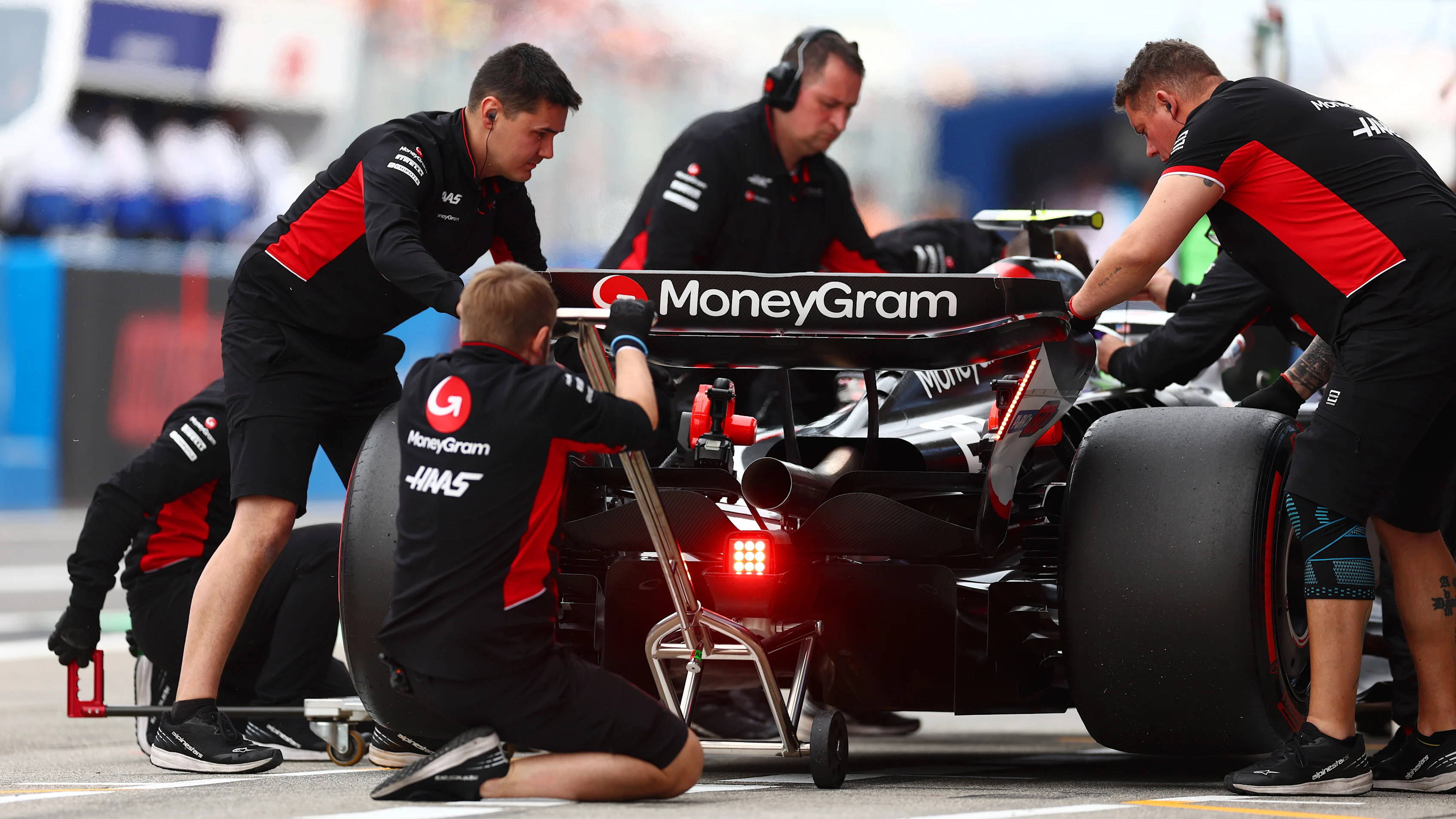 SUZUKA, JAPAN - APRIL 06: Nico Hulkenberg of Germany driving the (27) Haas F1 VF-24 Ferrari stops in the Pitlane during qualifying ahead of the F1 Grand Prix of Japan at Suzuka International Racing Course on April 06, 2024 in Suzuka, Japan. (Photo by Bryn Lennon - Formula 1/Formula 1 via Getty Images)
