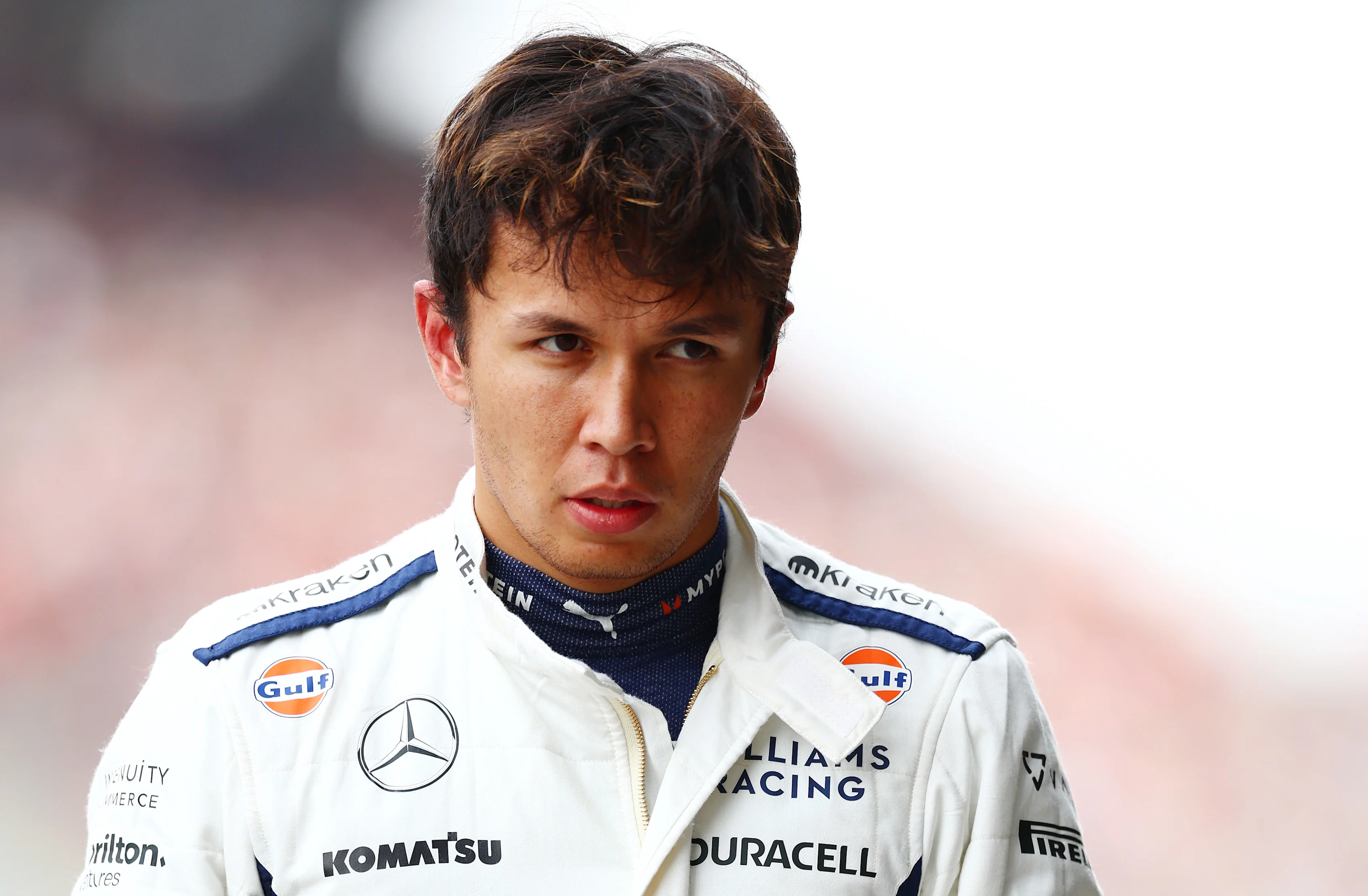 SUZUKA, JAPAN - APRIL 06: 14th placed qualifier Alexander Albon of Thailand and Williams walks in