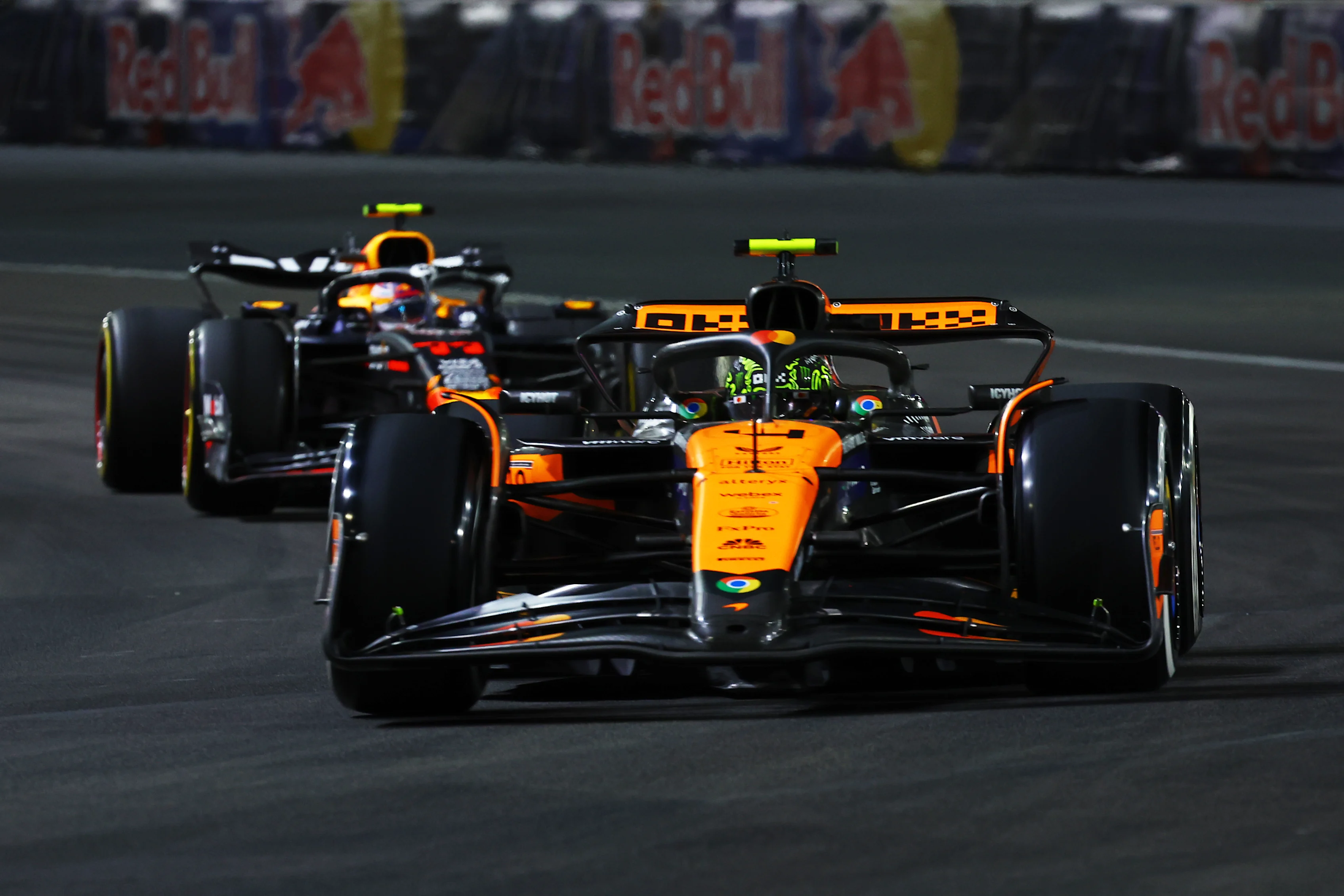 LAS VEGAS, NEVADA - NOVEMBER 23: Lando Norris driving the (4) McLaren MCL38 Mercedes leads Sergio Perez driving during the F1 Grand Prix of Las Vegas at Las Vegas Strip Circuit on November 23, 2024. (Photo by Mark Thompson/Getty Images)