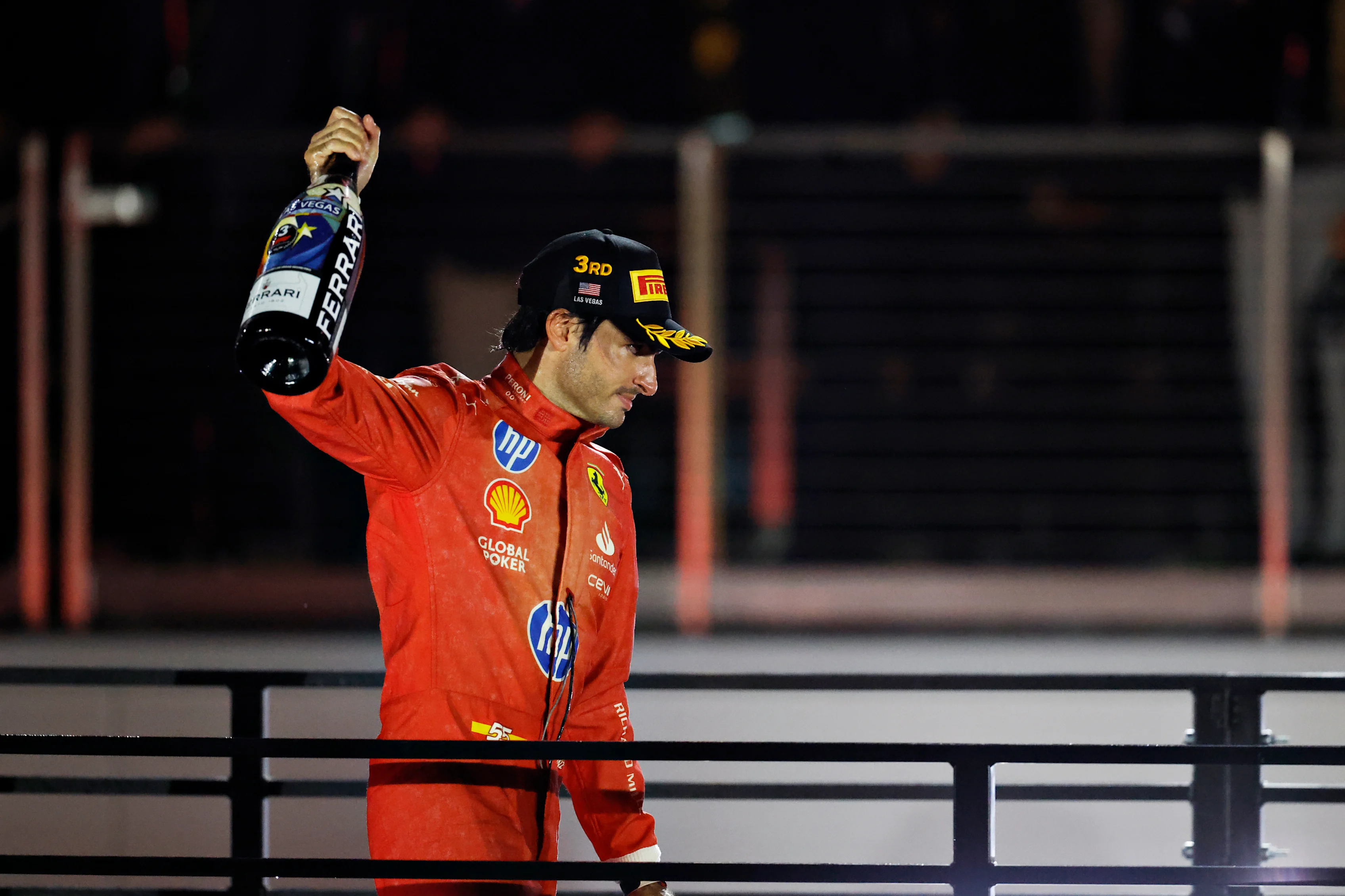 LAS VEGAS, NEVADA - NOVEMBER 23: Third placed Carlos Sainz of Spain and Ferrari celebrates on the podium during the F1 Grand Prix of Las Vegas at Las Vegas Strip Circuit on November 23, 2024 in Las Vegas, Nevada. (Photo by Chris Graythen/Getty Images)