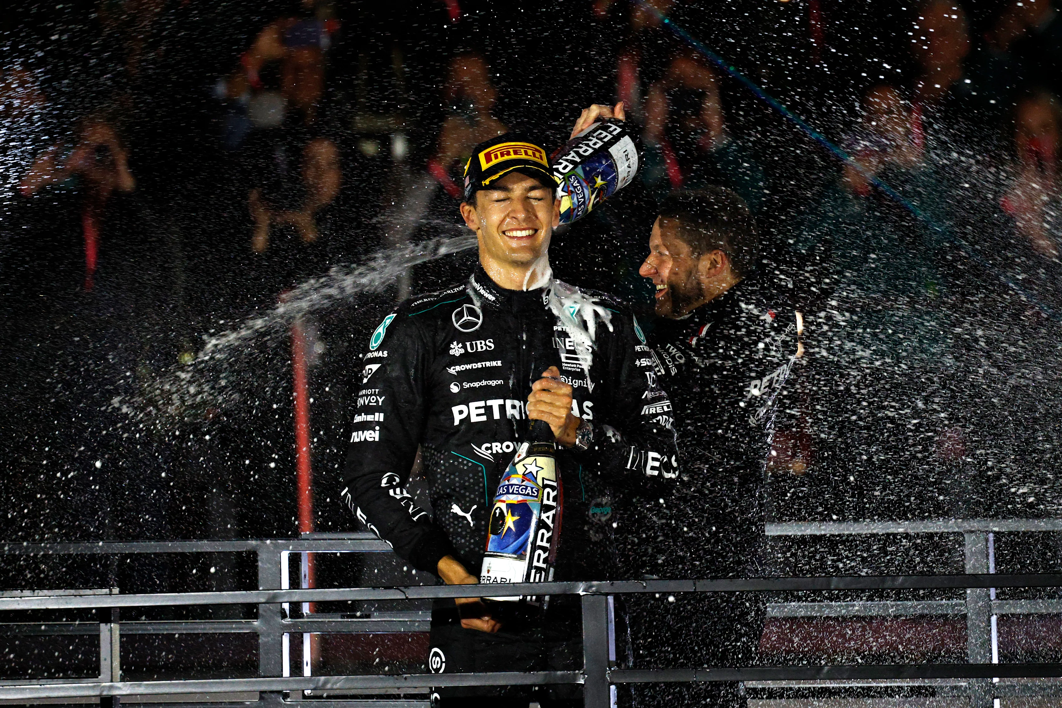 LAS VEGAS, NEVADA - NOVEMBER 23: Race winner George Russell of Great Britain and Mercedes celebrates on the podium during the F1 Grand Prix of Las Vegas at Las Vegas Strip Circuit on November 23, 2024 in Las Vegas, Nevada. (Photo by Chris Graythen/Getty Images)