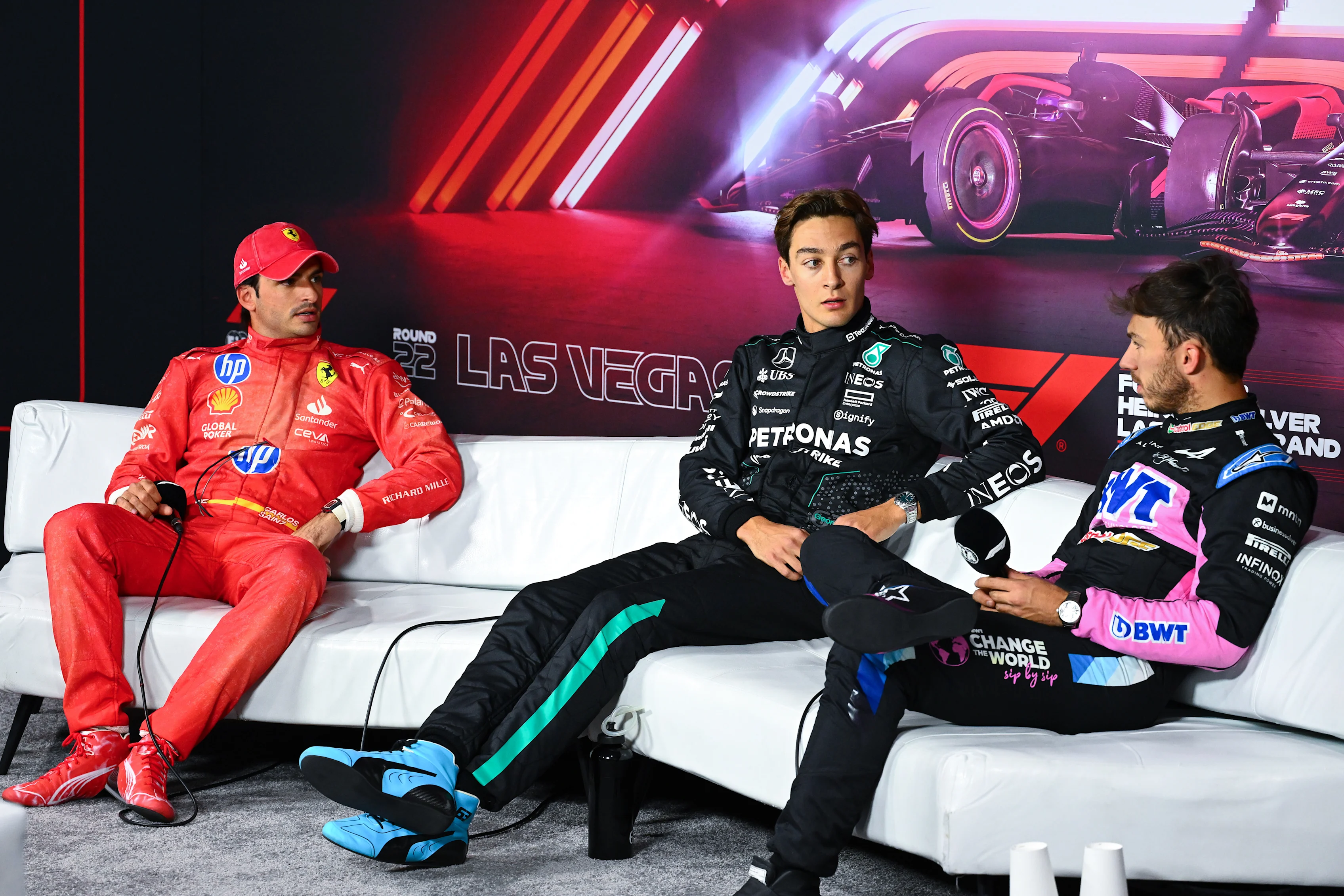 LAS VEGAS, NEVADA - NOVEMBER 22: Pole position qualifier George Russell of Great Britain and Mercedes, Second placed qualifier Carlos Sainz of Spain and Ferrari and Third placed qualifier Pierre Gasly of France and Alpine F1 attend the press conference after qualifying ahead of the F1 Grand Prix of Las Vegas at Las Vegas Strip Circuit on November 22, 2024 in Las Vegas, Nevada. (Photo by Mark Sutton - Formula 1/Formula 1 via Getty Images)