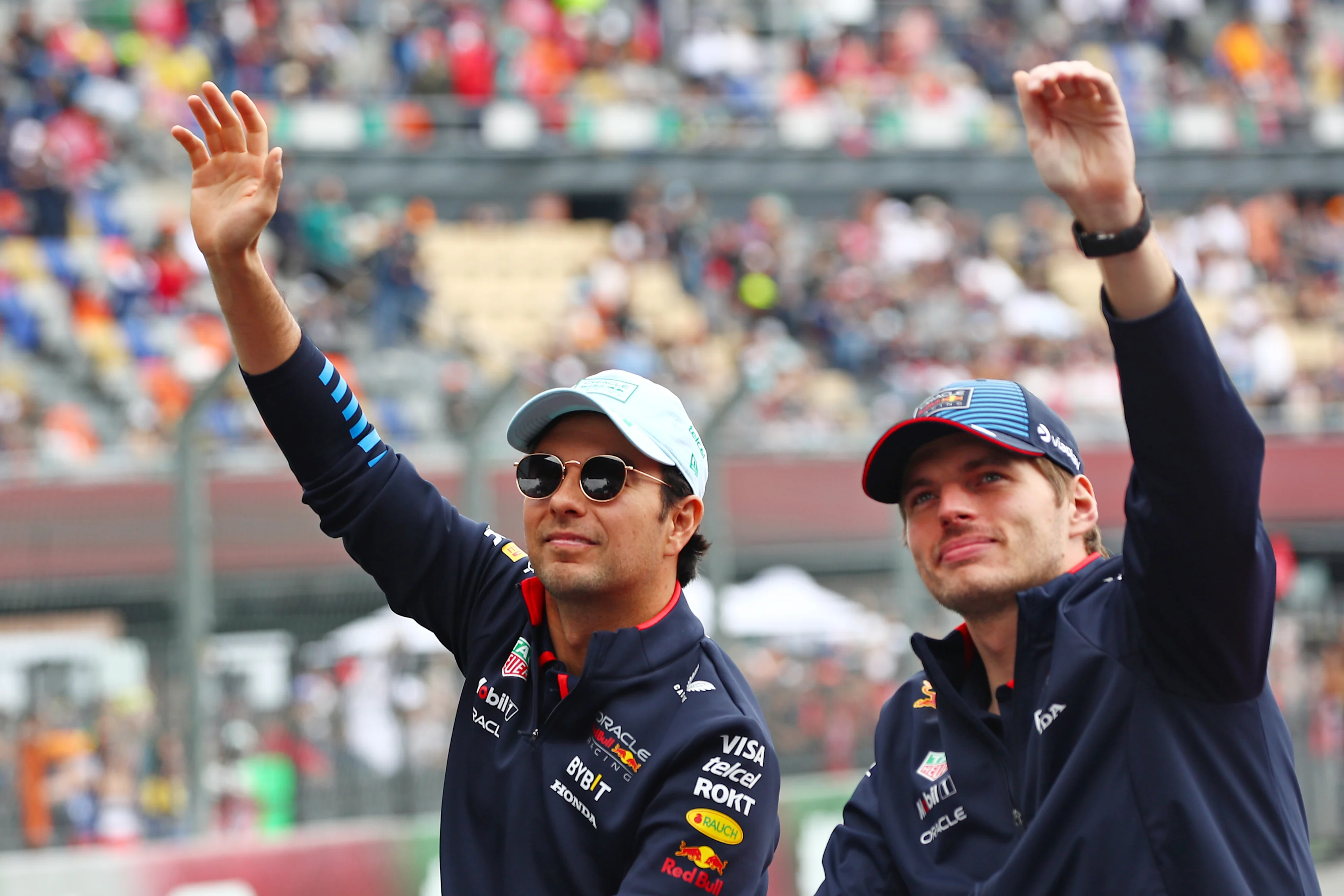 MEXICO CITY, MEXICO - OCTOBER 27: Sergio Perez and Max Verstappen wave to the crowd on the drivers parade prior to the F1 Grand Prix of Mexico at Autodromo Hermanos Rodriguez on October 27, 2024. (Photo by Peter Fox - Formula 1/Formula 1 via Getty Images)