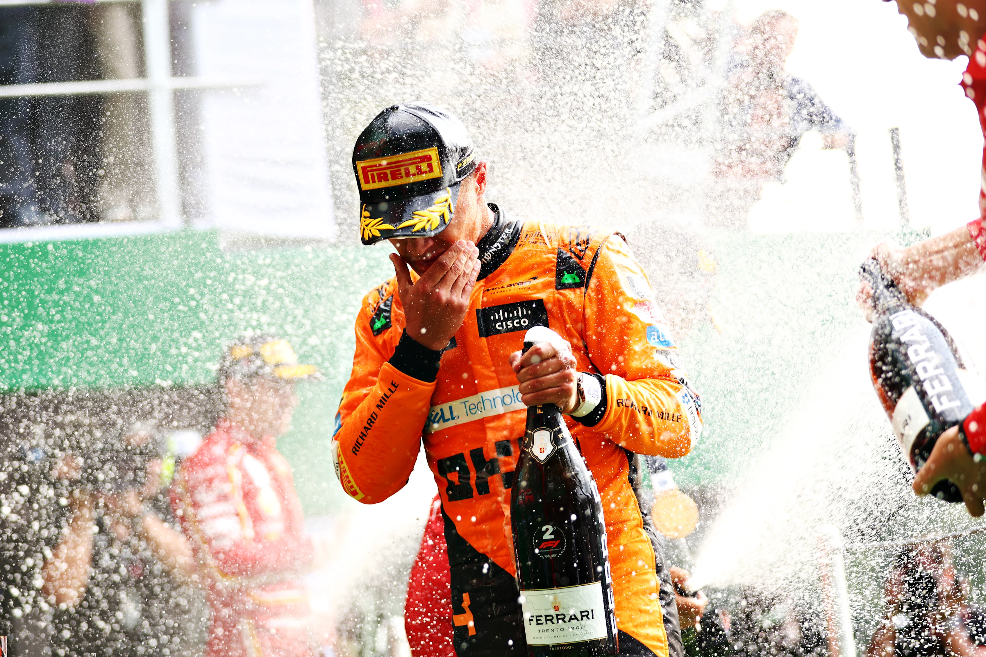MEXICO CITY, MEXICO - OCTOBER 27: Second placed Lando Norris of Great Britain and McLaren celebrates on the podium after the F1 Grand Prix of Mexico at Autodromo Hermanos Rodriguez on October 27, 2024 in Mexico City, Mexico. (Photo by Bryn Lennon - Formula 1/Formula 1 via Getty Images)