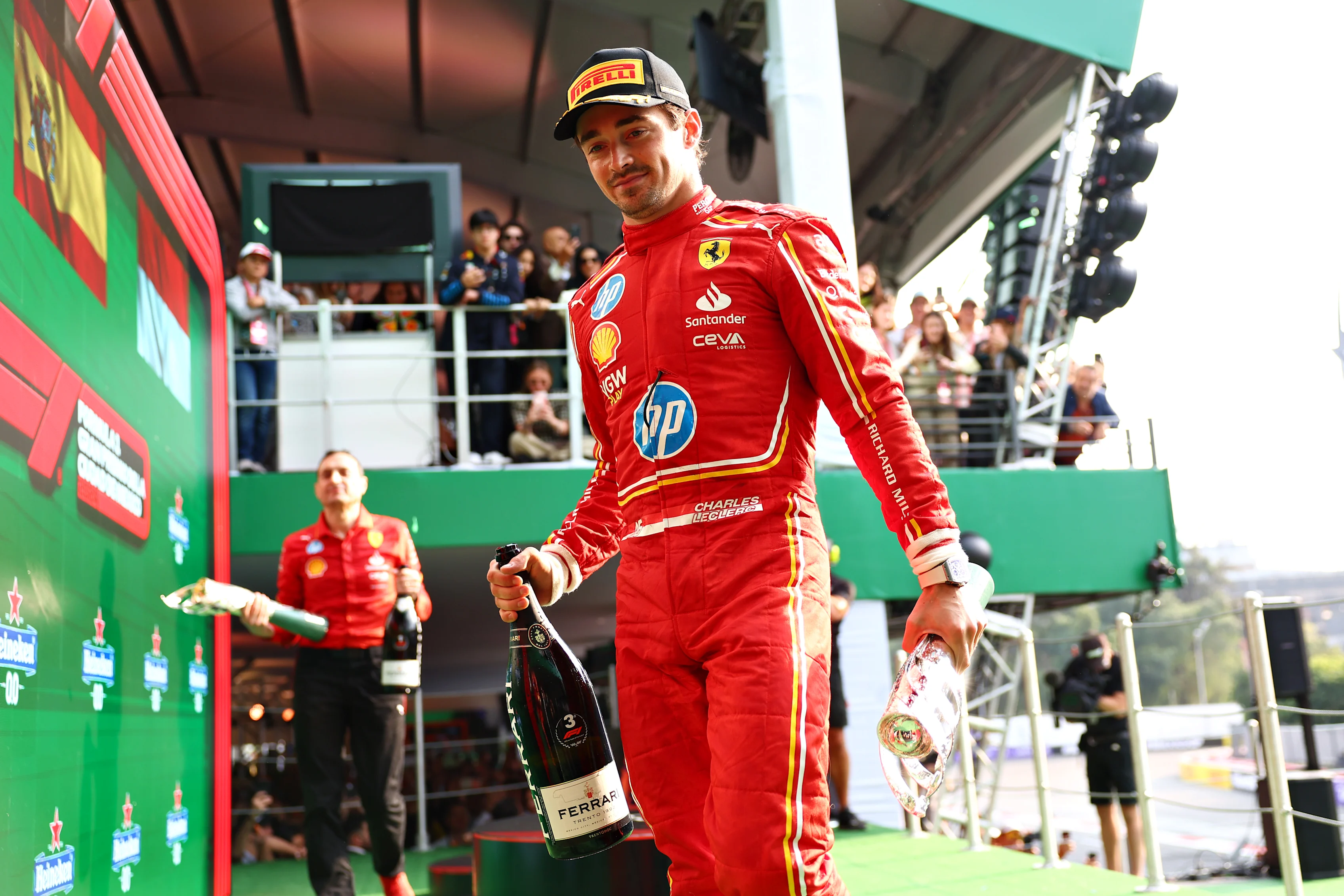 MEXICO CITY, MEXICO - OCTOBER 27: Third placed Charles Leclerc of Monaco and Ferrari on the podium