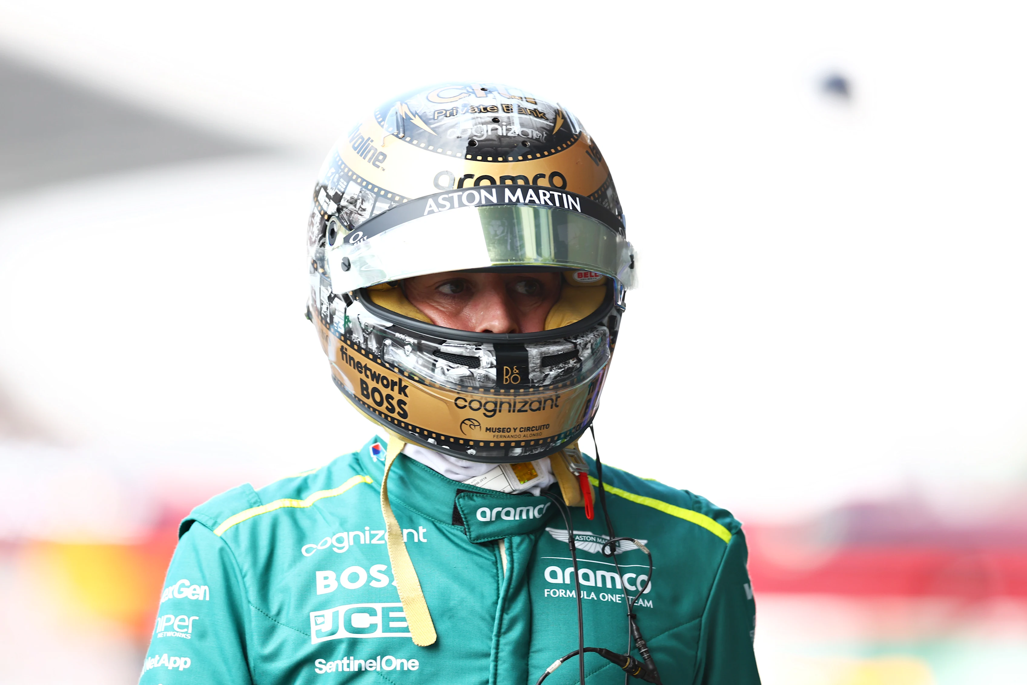 MEXICO CITY, MEXICO - OCTOBER 26: 13th placed qualifier Fernando Alonso of Spain and Aston Martin F1 Team walks in the Pitlane during qualifying ahead of the F1 Grand Prix of Mexico at Autodromo Hermanos Rodriguez on October 26, 2024 in Mexico City, Mexico. (Photo by Bryn Lennon - Formula 1/Formula 1 via Getty Images)