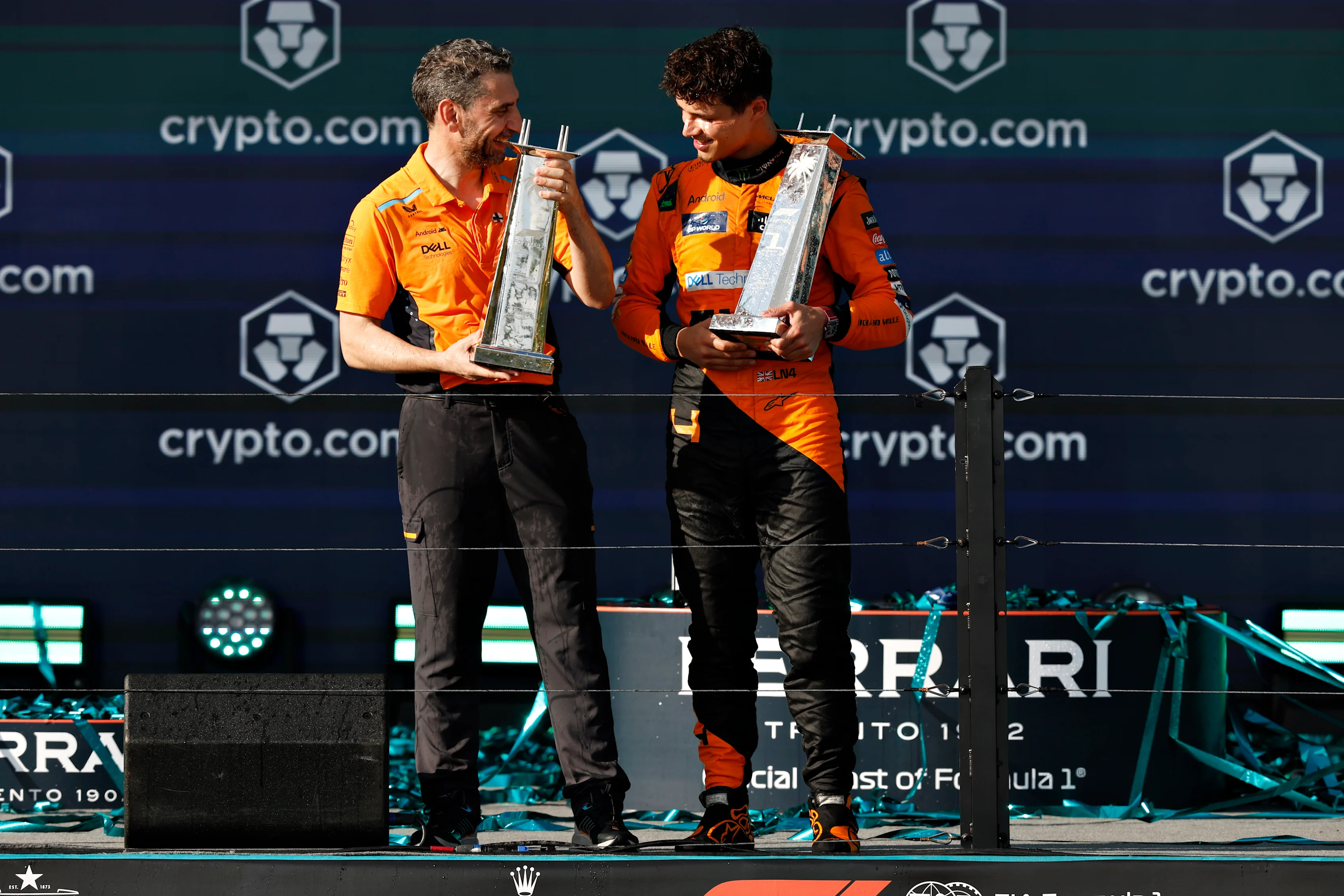 MIAMI, FLORIDA - MAY 05: Race winner Lando Norris of Great Britain and McLaren and McLaren Team Principal Andrea Stella celebrate on the podium after the F1 Grand Prix of Miami at Miami International Autodrome on May 05, 2024 in Miami, Florida. (Photo by Chris Graythen/Getty Images)