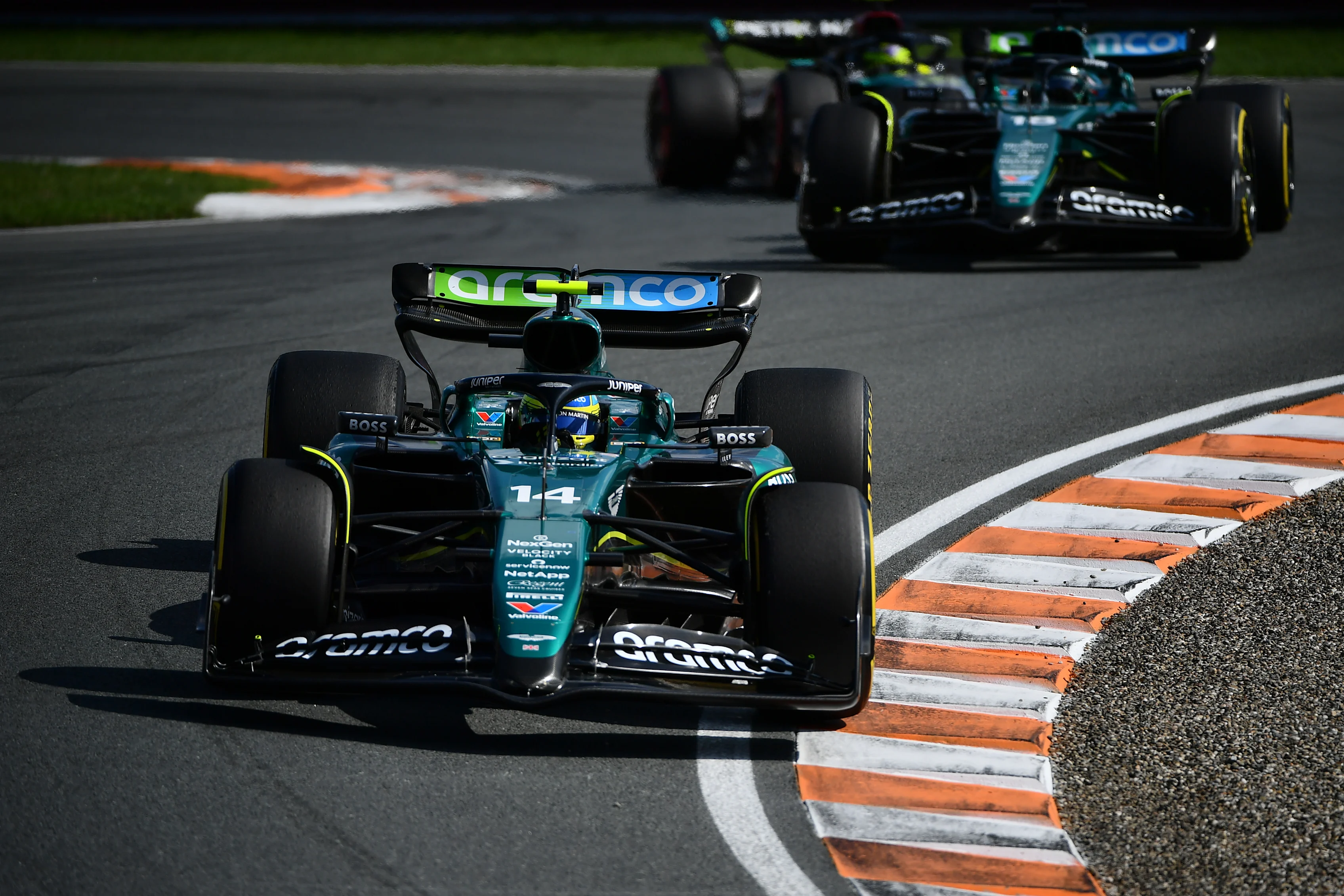 ZANDVOORT, NETHERLANDS - AUGUST 25: Fernando Alonso of Spain driving the (14) Aston Martin AMR24 Mercedes leads Lance Stroll of Canada driving the (18) Aston Martin AMR24 Mercedes during the F1 Grand Prix of Netherlands at Circuit Zandvoort on August 25, 2024 in Zandvoort, Netherlands. (Photo by James Sutton - Formula 1/Formula 1 via Getty Images)