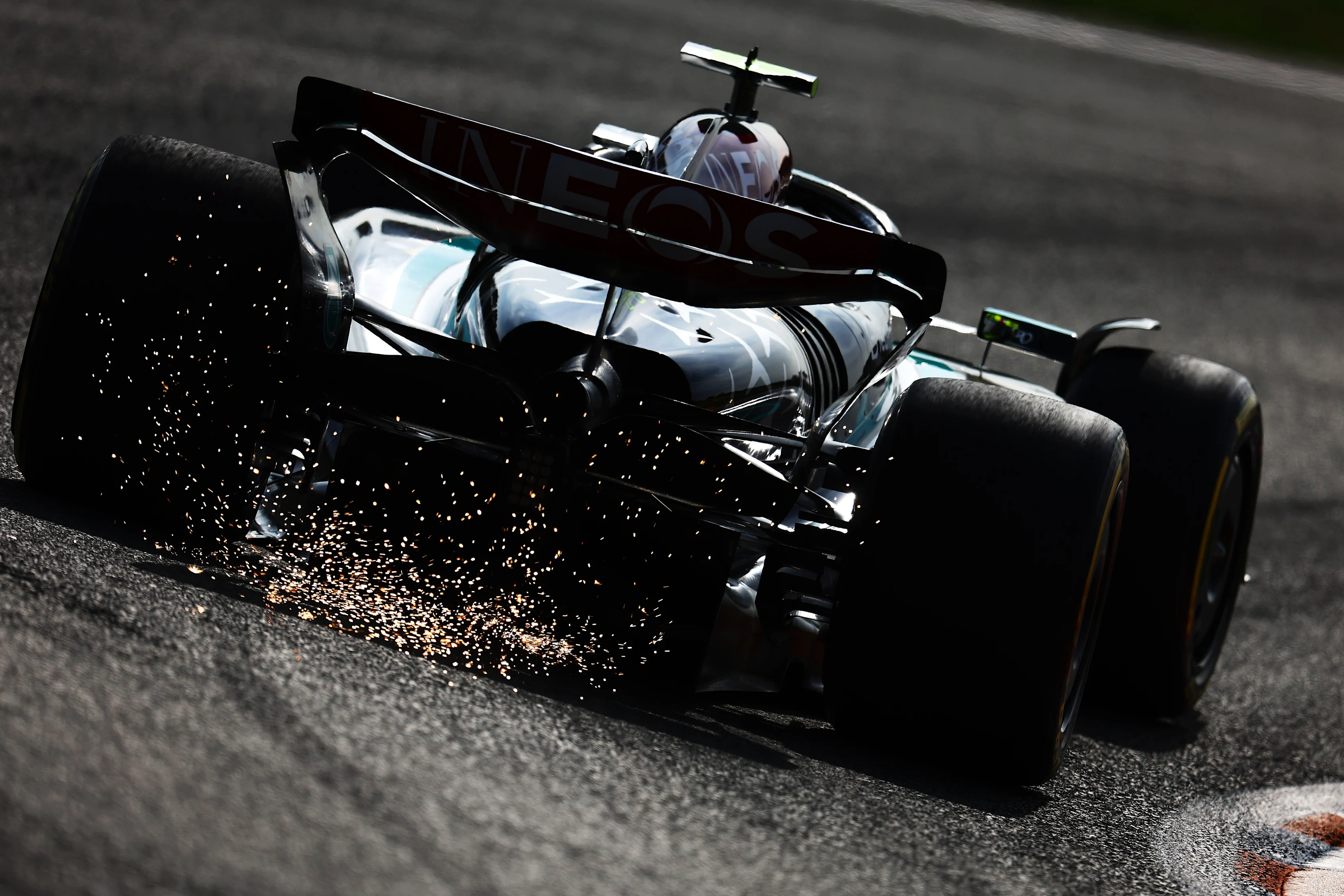 ZANDVOORT, NETHERLANDS - AUGUST 23: Sparks fly behind Lewis Hamilton of Great Britain driving the (44) Mercedes AMG Petronas F1 Team W15 on track during practice ahead of the F1 Grand Prix of Netherlands at Circuit Zandvoort on August 23, 2024 in Zandvoort, Netherlands. (Photo by Clive Rose/Getty Images)