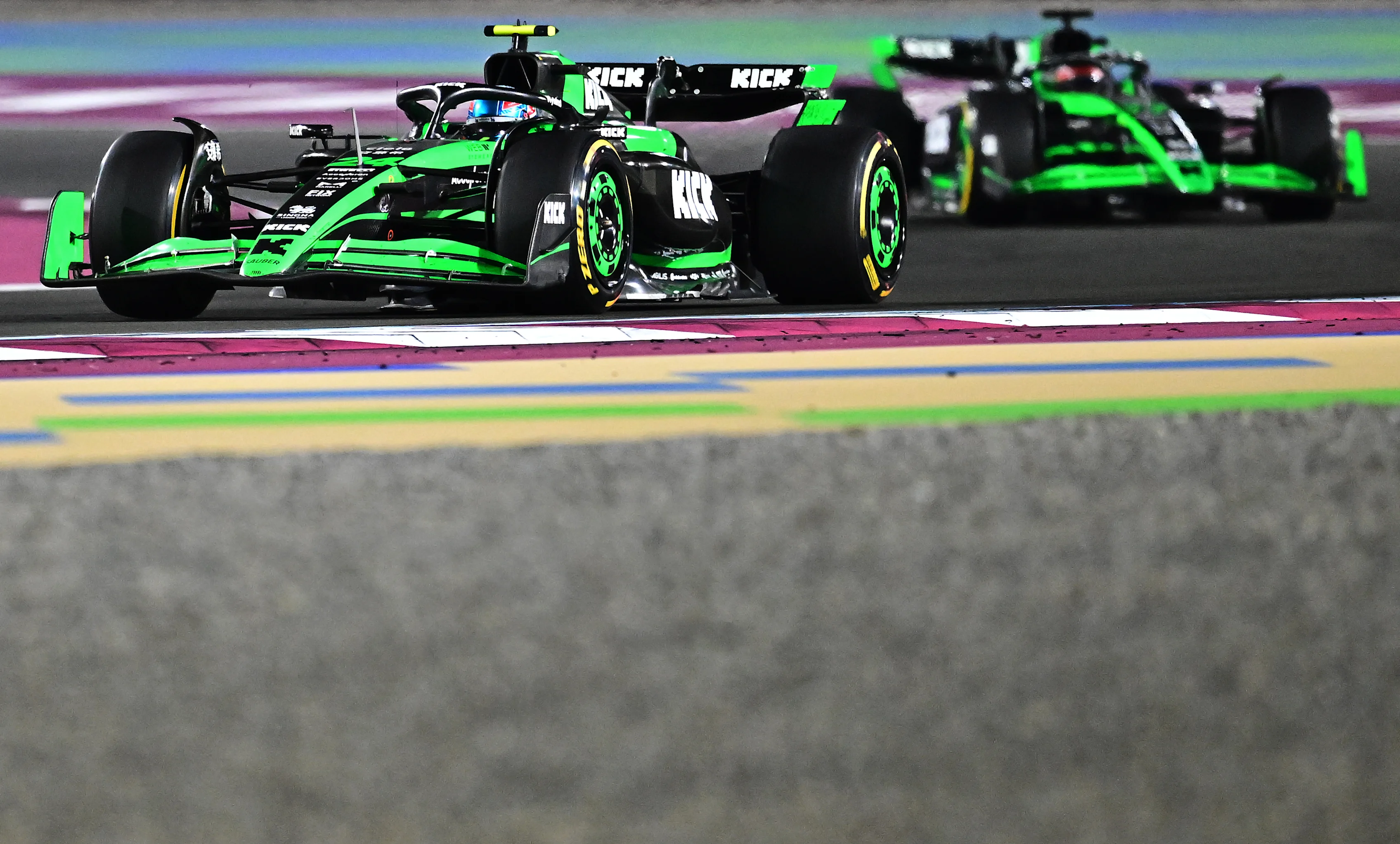 LUSAIL CITY, QATAR - DECEMBER 01: Zhou Guanyu of China driving the (24) Kick Sauber C44 Ferrari leads Valtteri Bottas of Finland driving the (77) Kick Sauber C44 Ferrari on track during the F1 Grand Prix of Qatar at Lusail International Circuit on December 01, 2024 in Lusail City, Qatar. (Photo by Pauline Ballet - Formula 1/Formula 1 via Getty Images)