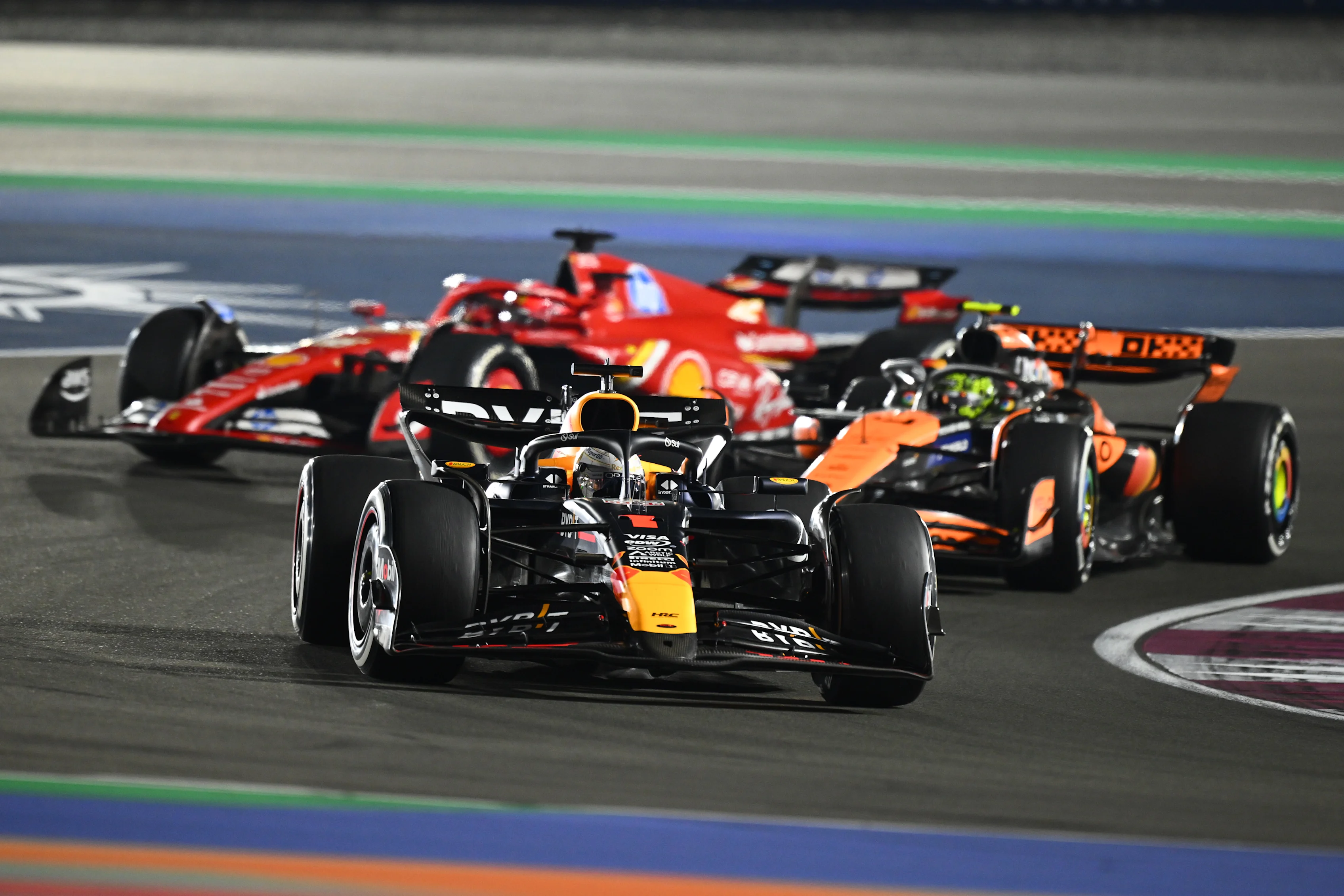 Max Verstappen driving the (1) Oracle Red Bull Racing RB20 leads Lando Norris and Charles Leclerc during the F1 Grand Prix of Qatar at Lusail International Circuit on December 01, 2024 in Lusail City, Qatar. (Photo by Clive Mason/Getty Images)