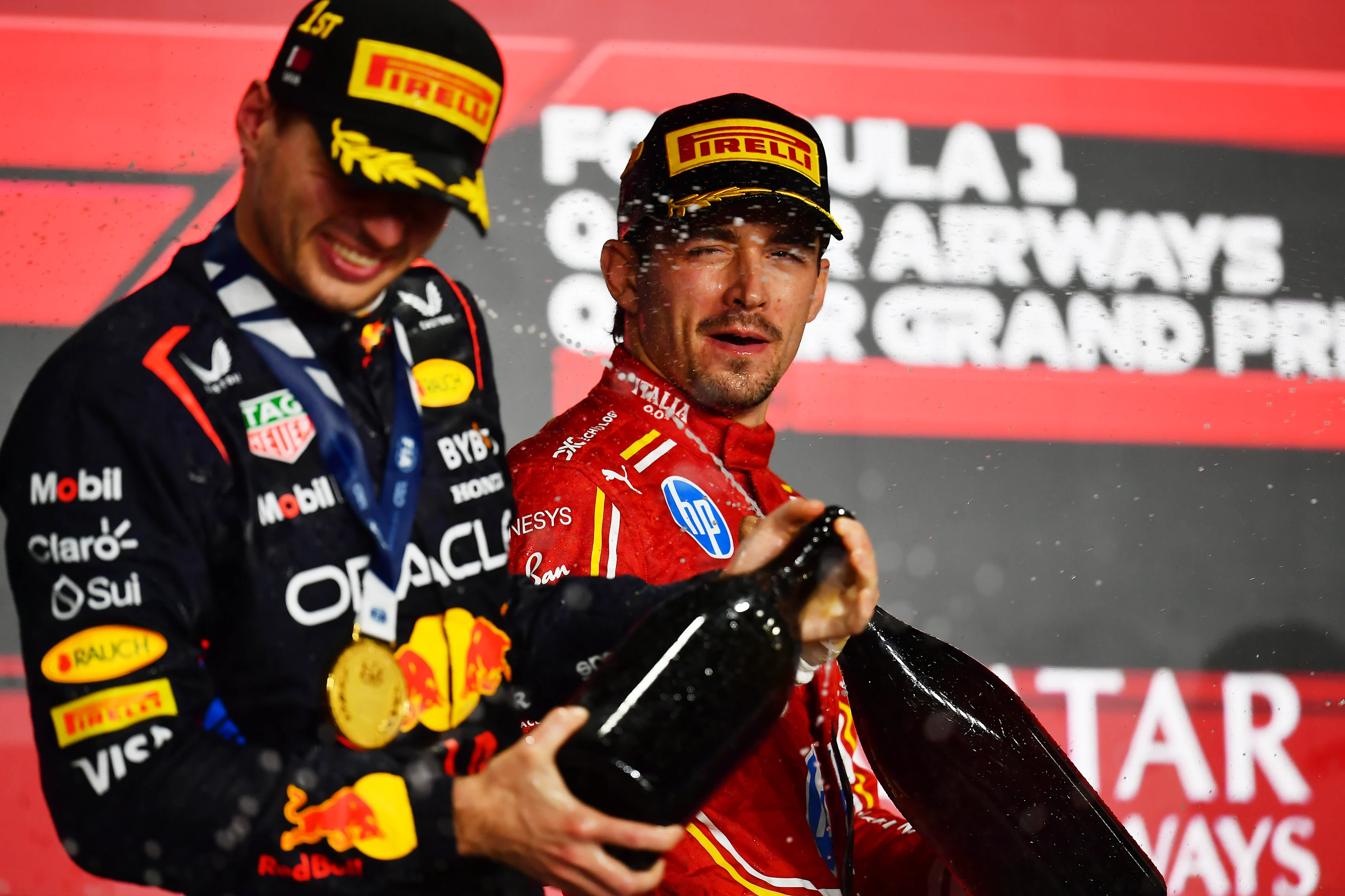 Charles Leclerc and Race winner Max Verstappen celebrate during the F1 Grand Prix of Qatar at Lusail International Circuit on December 01, 2024 in Lusail City, Qatar. (Photo by James Sutton - Formula 1/Formula 1 via Getty Images)