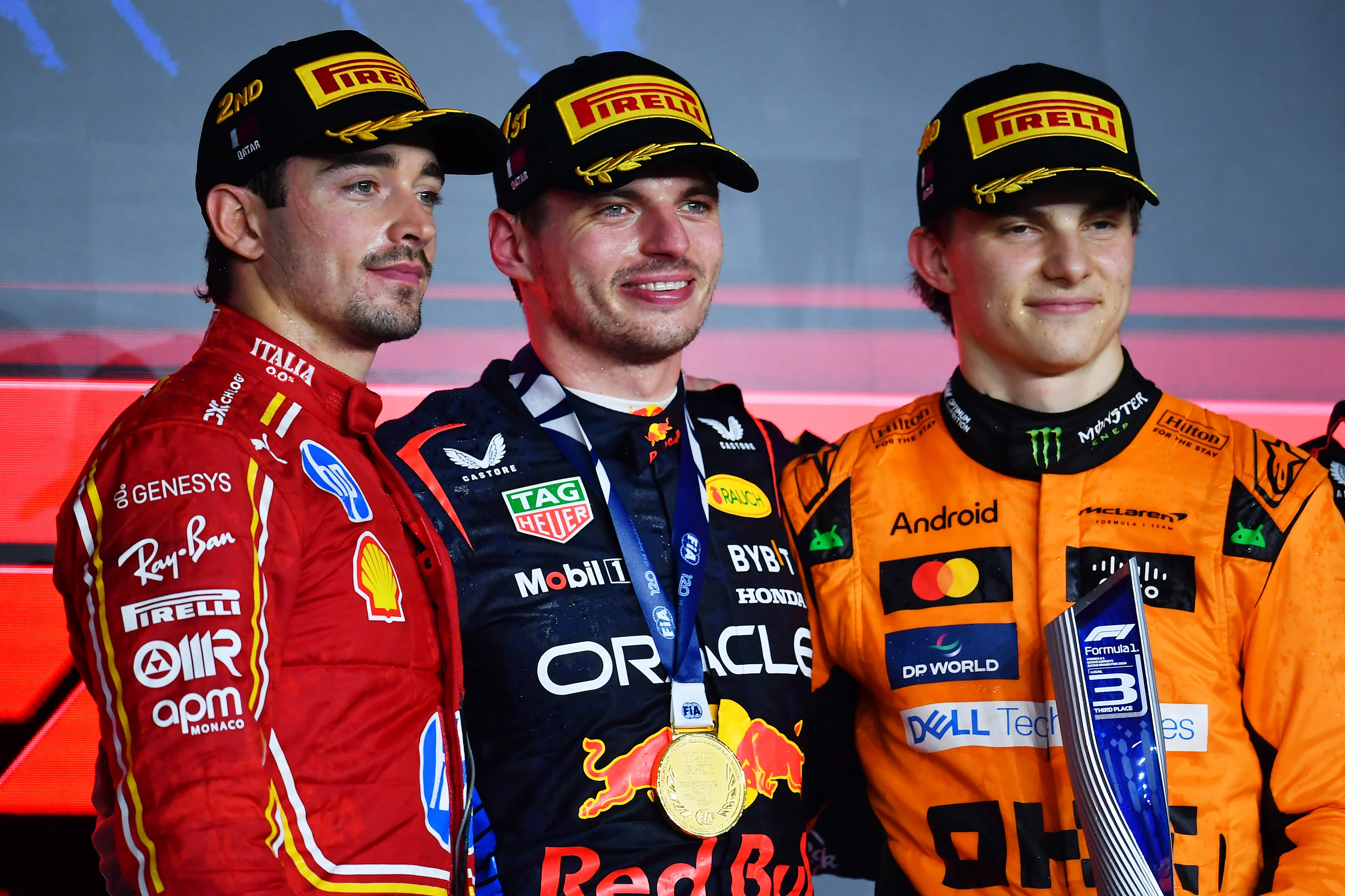 Max Verstappen, Charles Leclerc and Oscar Piastri celebrate on the podium during the F1 Grand Prix of Qatar at Lusail International Circuit on December 01, 2024 in Lusail City, Qatar. (Photo by James Sutton - Formula 1/Formula 1 via Getty Images)