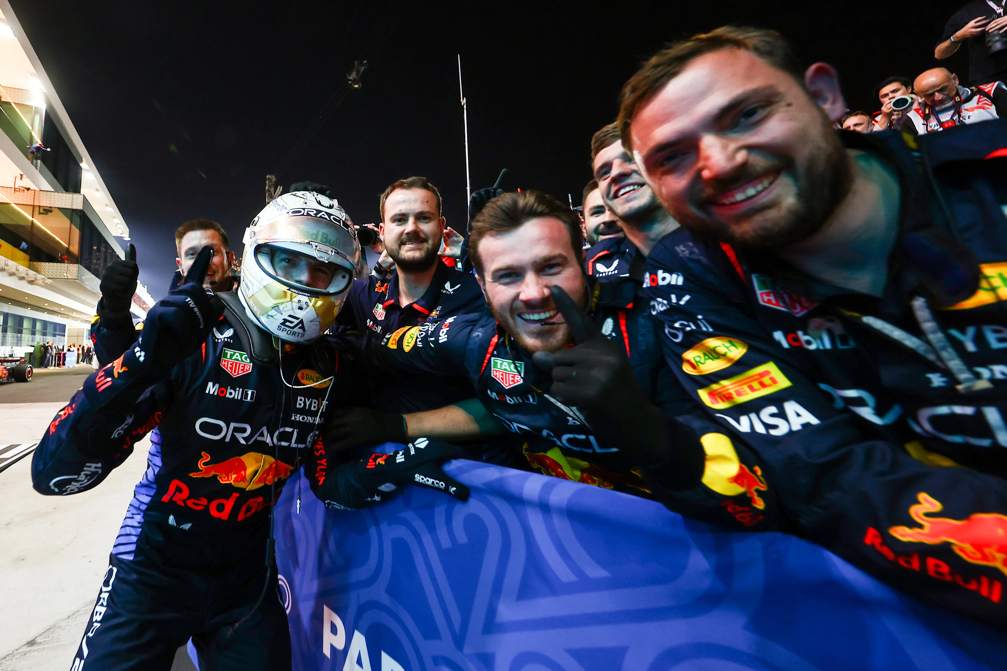 LUSAIL CITY, QATAR - DECEMBER 01: Race winner Max Verstappen of the Netherlands and Oracle Red Bull Racing celebrates with Oracle Red Bull Racing team members in parc ferme during the F1 Grand Prix of Qatar at Lusail International Circuit on December 01, 2024 in Lusail City, Qatar. (Photo by Mark Thompson/Getty Images)