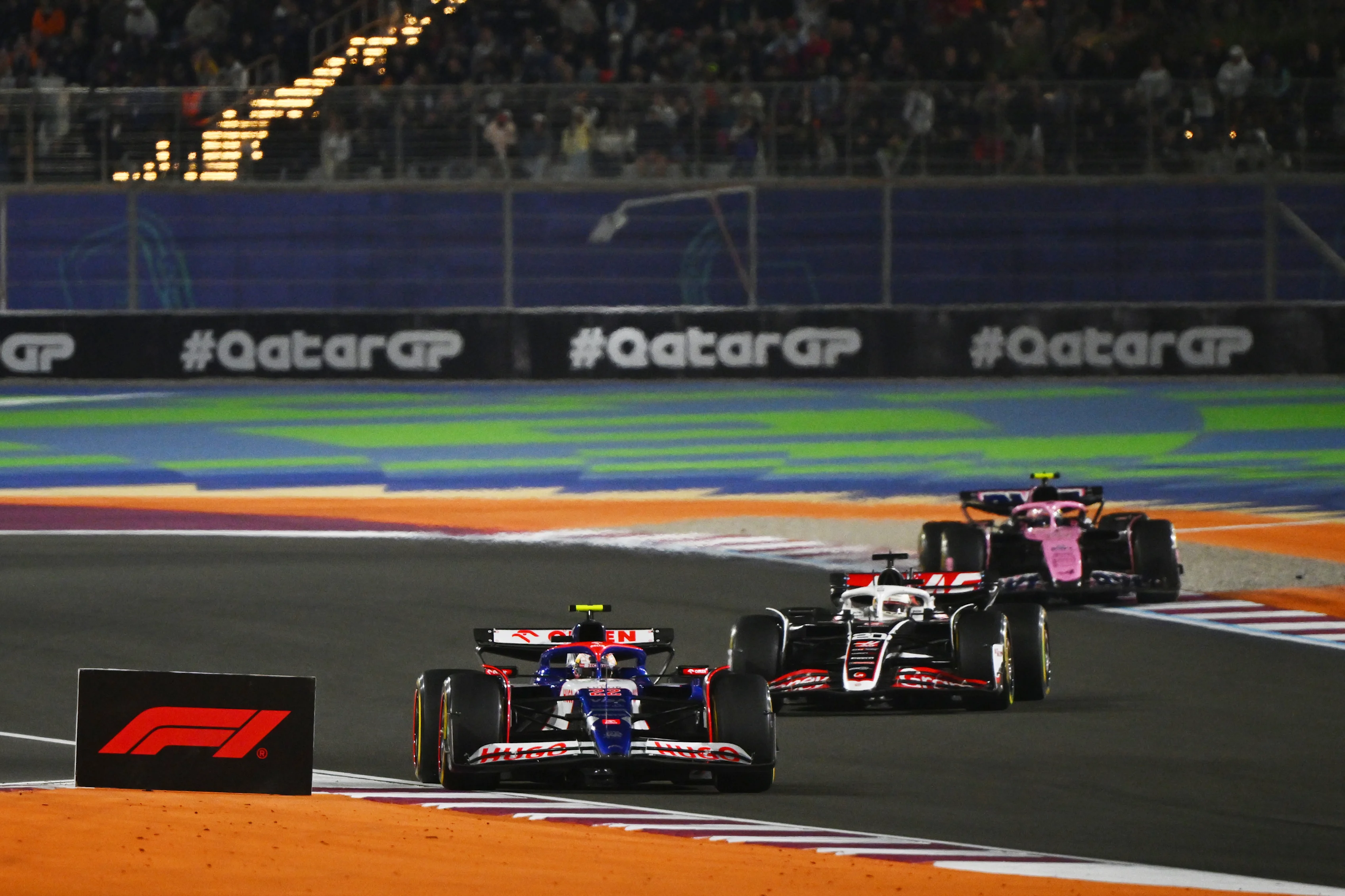 Yuki Tsunoda leads Kevin Magnussen and Pierre Gasly on track during the F1 Grand Prix of Qatar at Lusail International Circuit on December 01, 2024 in Lusail City, Qatar. (Photo by Mark Sutton - Formula 1/Formula 1 via Getty Images)