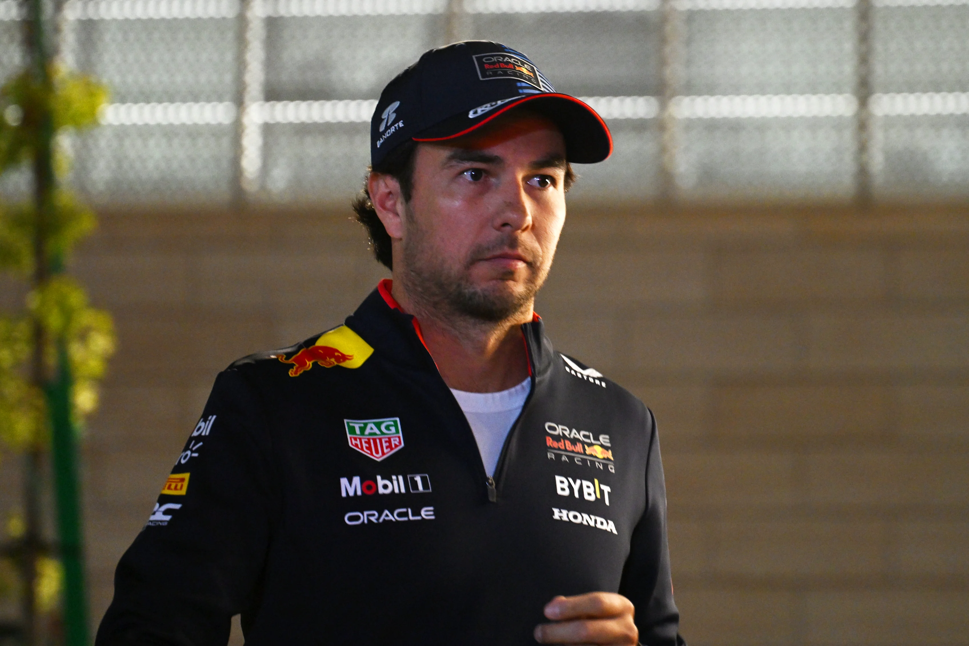 LUSAIL CITY, QATAR - NOVEMBER 28: Sergio Perez of Mexico and Oracle Red Bull Racing walks in the