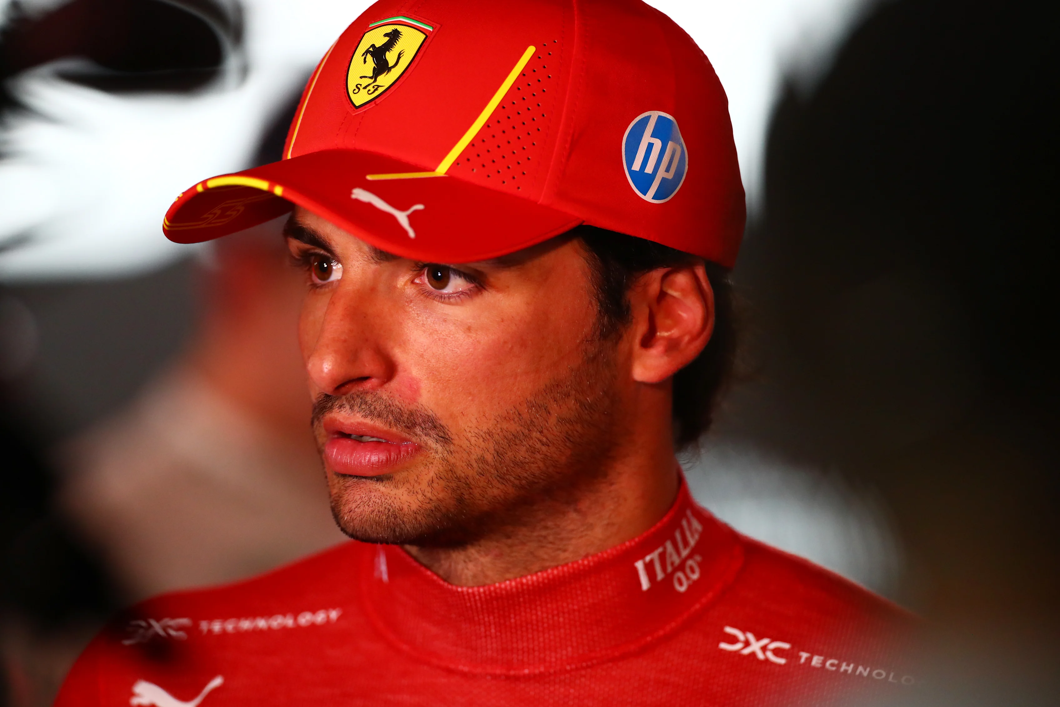 LUSAIL CITY, QATAR - NOVEMBER 30: 4th placed Carlos Sainz of Spain and Ferrari talks to the media in the Paddock after the Sprint ahead of the F1 Grand Prix of Qatar at Lusail International Circuit on November 30, 2024 in Lusail City, Qatar. (Photo by Peter Fox/Getty Images)