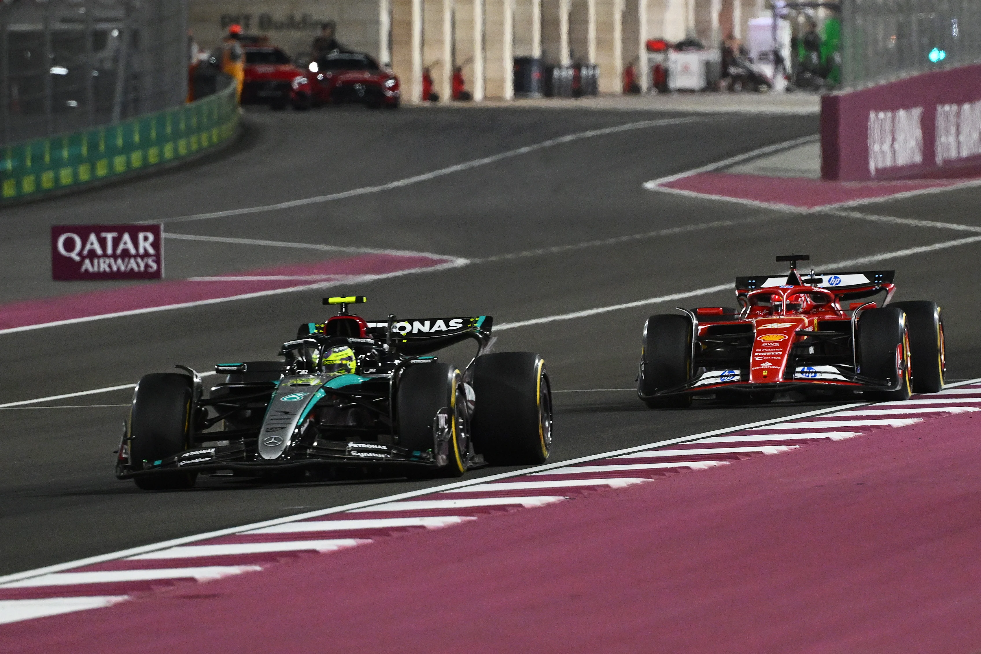 LLewis Hamilton leads Charles Leclerc driving the Ferrari SF-24 during the Sprint ahead of the F1 Grand Prix of Qatar at Lusail International Circuit on November 30, 2024 in Lusail City, Qatar. (Photo by Mark Sutton - Formula 1/Formula 1 via Getty Images)
