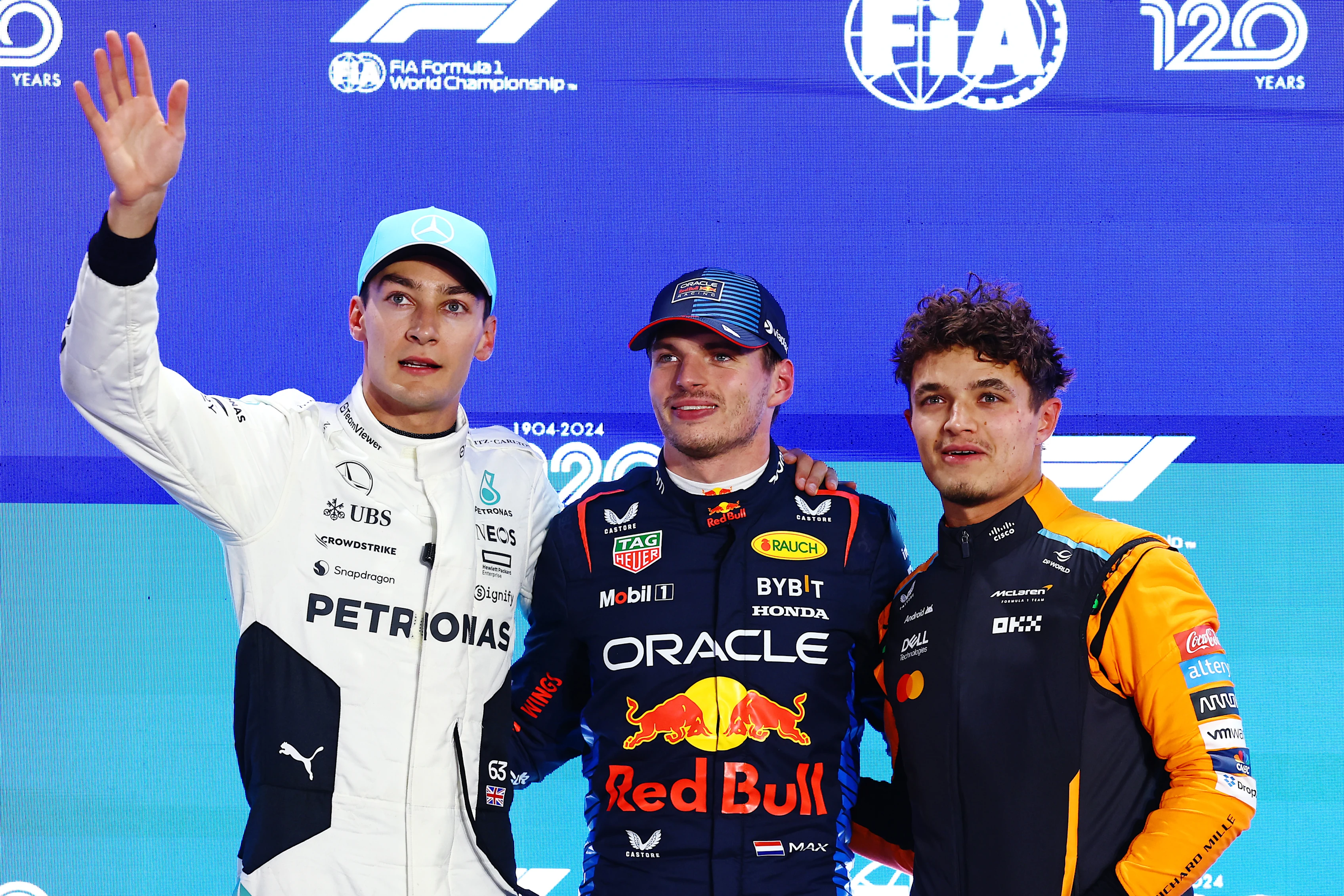 Max Verstappen, George Russell and Lando Norris pose for a photo in parc ferme during qualifying ahead of the F1 Grand Prix of Qatar at Lusail International Circuit on November 30, 2024 in Lusail City, Qatar. (Photo by Mark Thompson/Getty Images)