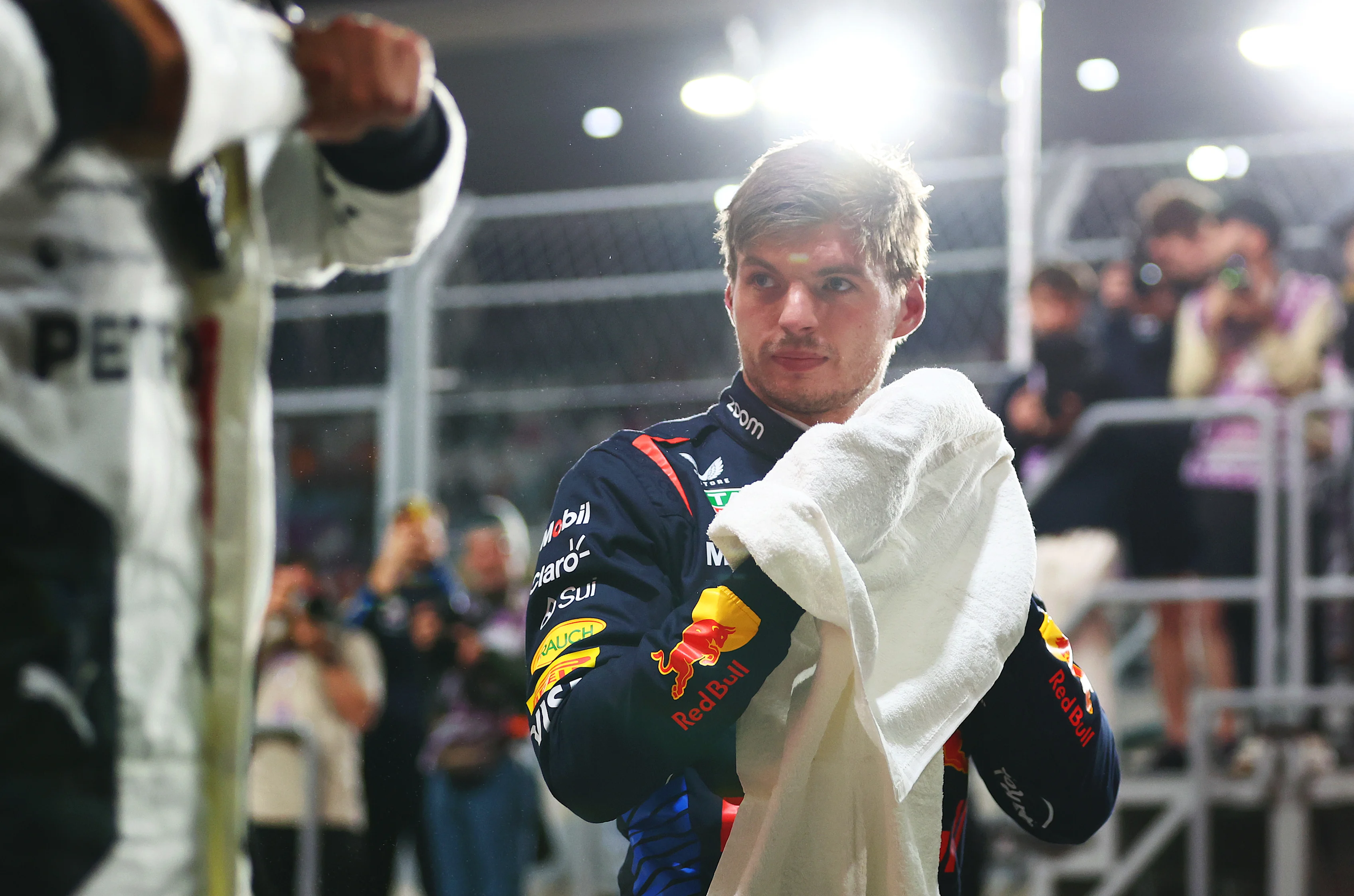 LUSAIL CITY, QATAR - NOVEMBER 30: Pole position qualifier Max Verstappen of the Netherlands and Oracle Red Bull Racing looks on in parc ferme during qualifying ahead of the F1 Grand Prix of Qatar at Lusail International Circuit on November 30, 2024 in Lusail City, Qatar. (Photo by Bryn Lennon - Formula 1/Formula 1 via Getty Images)