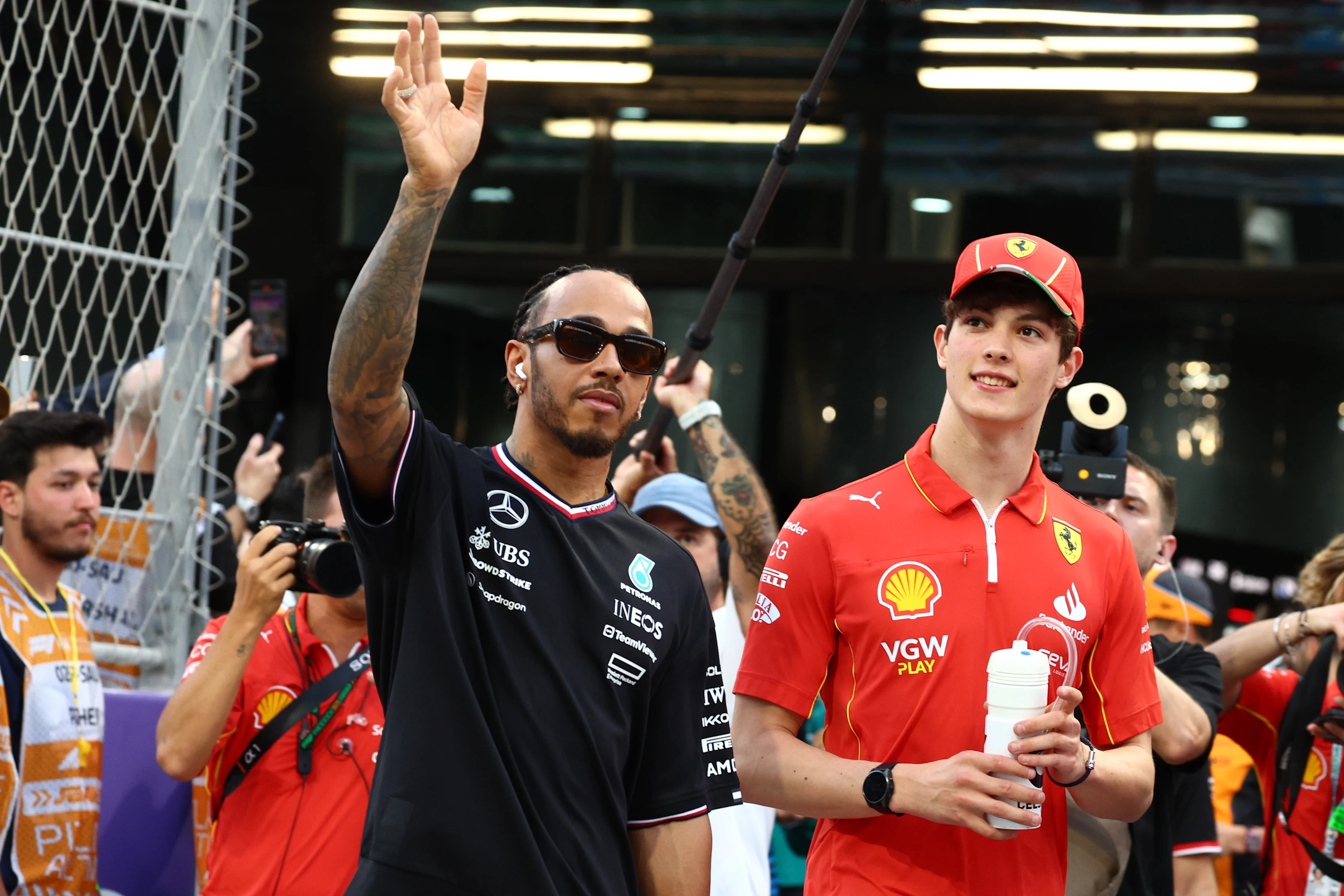 JEDDAH, SAUDI ARABIA - MARCH 09: Oliver Bearman of Great Britain and Ferrari and Lewis Hamilton of