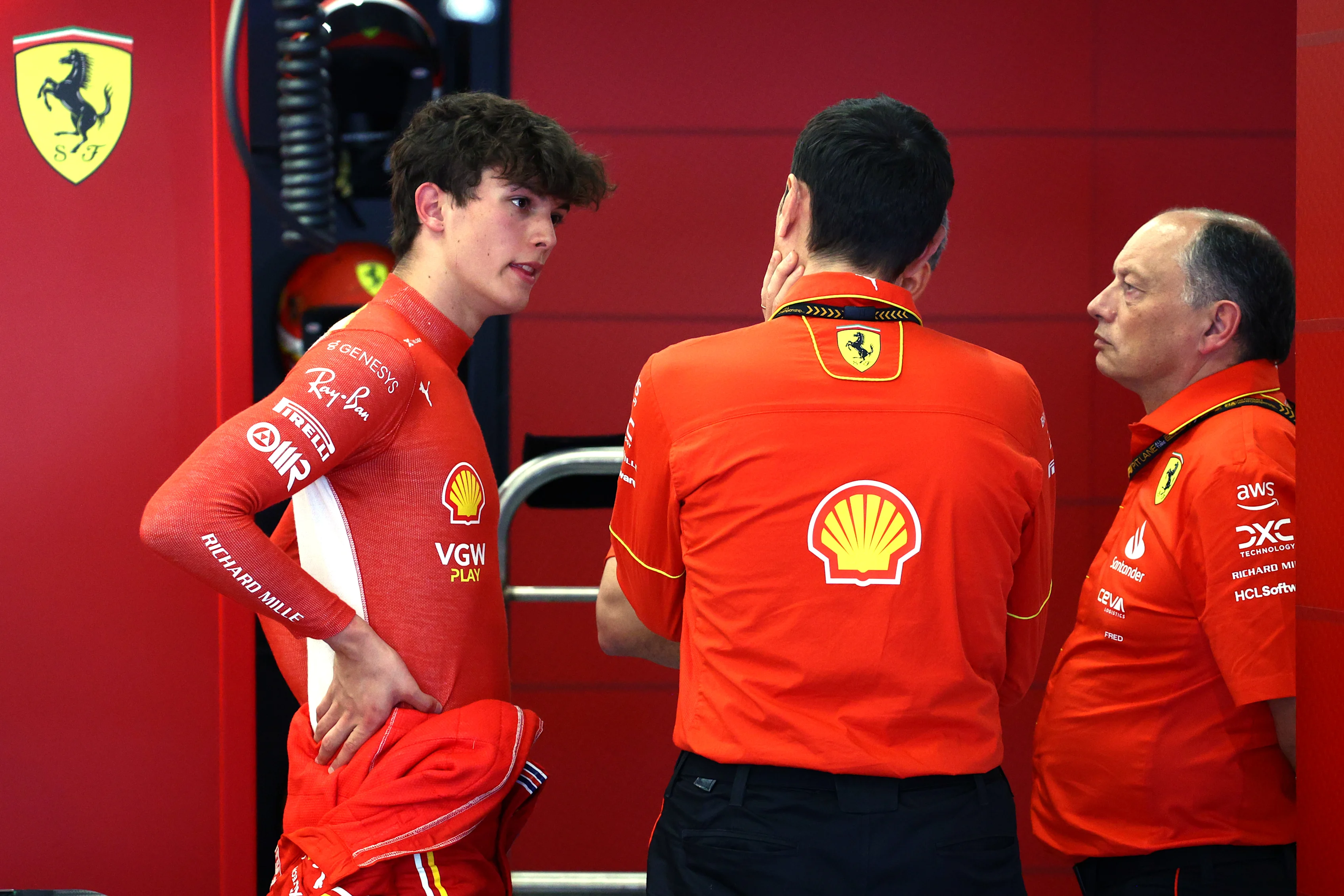 JEDDAH, SAUDI ARABIA - MARCH 08: Oliver Bearman of Great Britain and Ferrari speaks with Ferrari