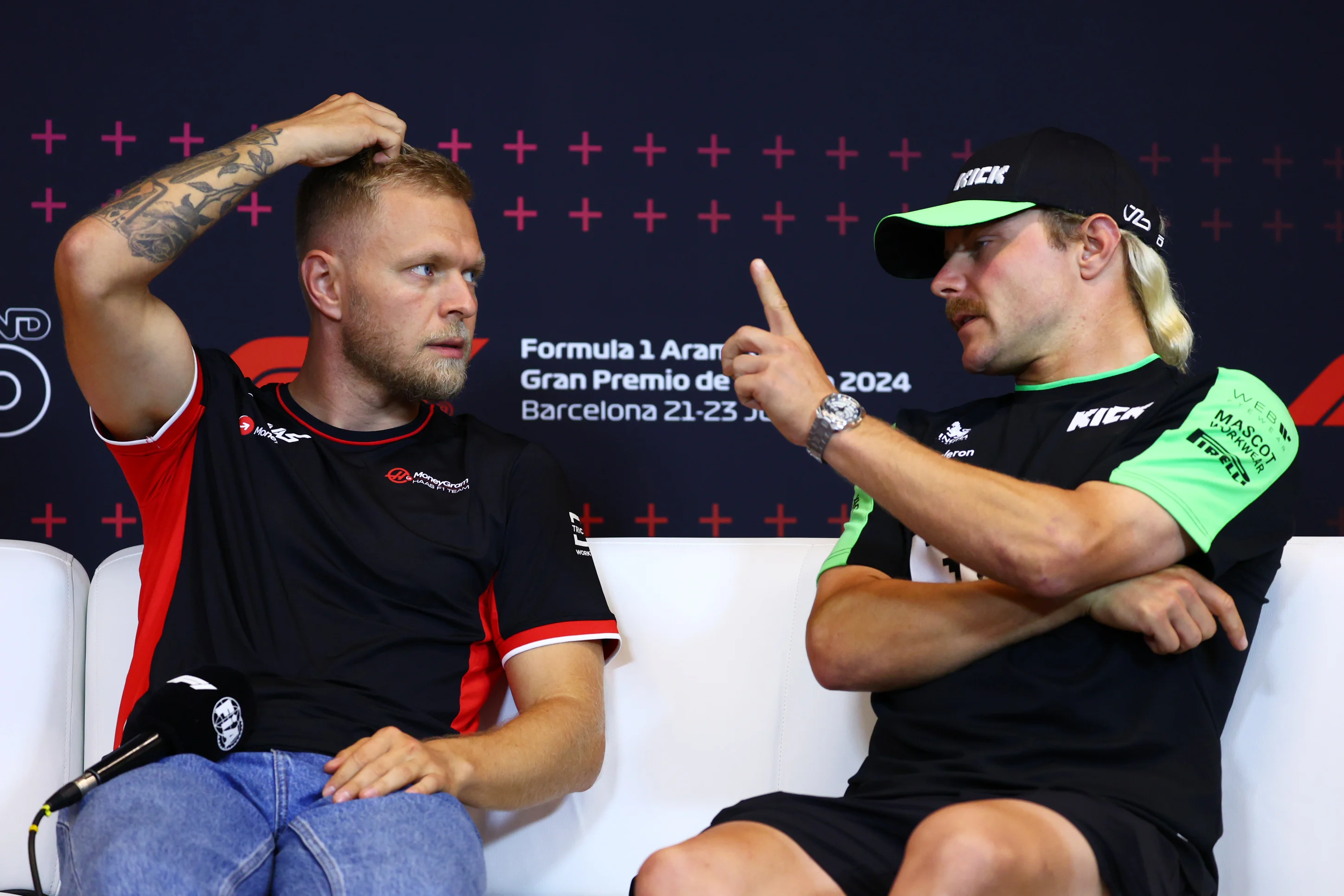 BARCELONA, SPAIN - JUNE 20: Kevin Magnussen of Denmark and Haas F1 and Valtteri Bottas of Finland and Stake F1 Team Kick Sauber attend the press conference during previews ahead of the F1 Grand Prix of Spain at Circuit de Barcelona-Catalunya on June 20, 2024 in Barcelona, Spain. (Photo by Clive Rose/Getty Images)