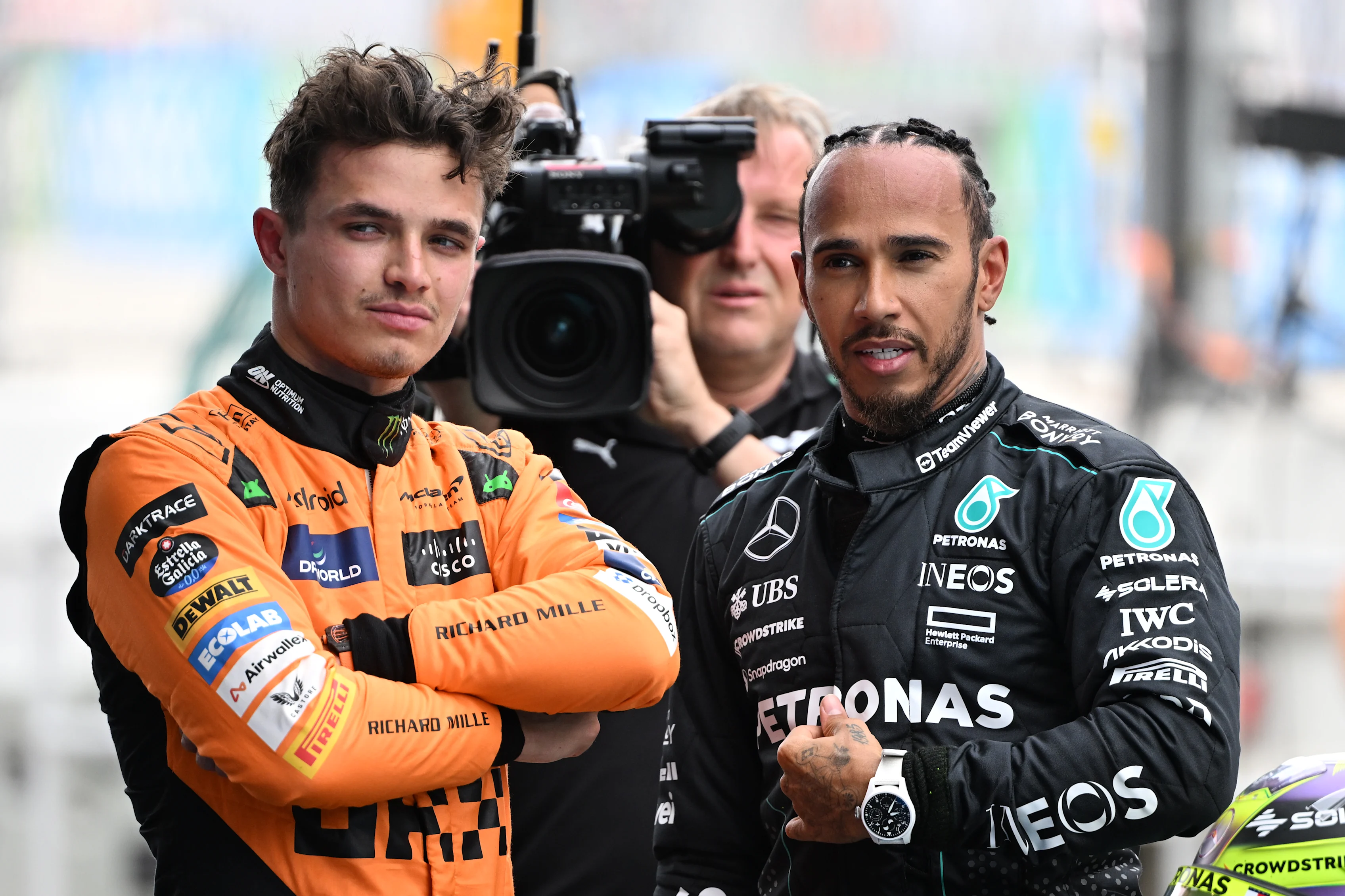 BARCELONA, SPAIN - JUNE 22: Pole position qualifier Lando Norris of Great Britain and McLaren and Third placed qualifier Lewis Hamilton of Great Britain and Mercedes talk in parc ferme during qualifying ahead of the F1 Grand Prix of Spain at Circuit de Barcelona-Catalunya on June 22, 2024 in Barcelona, Spain. (Photo by Mark Sutton - Formula 1/Formula 1 via Getty Images)