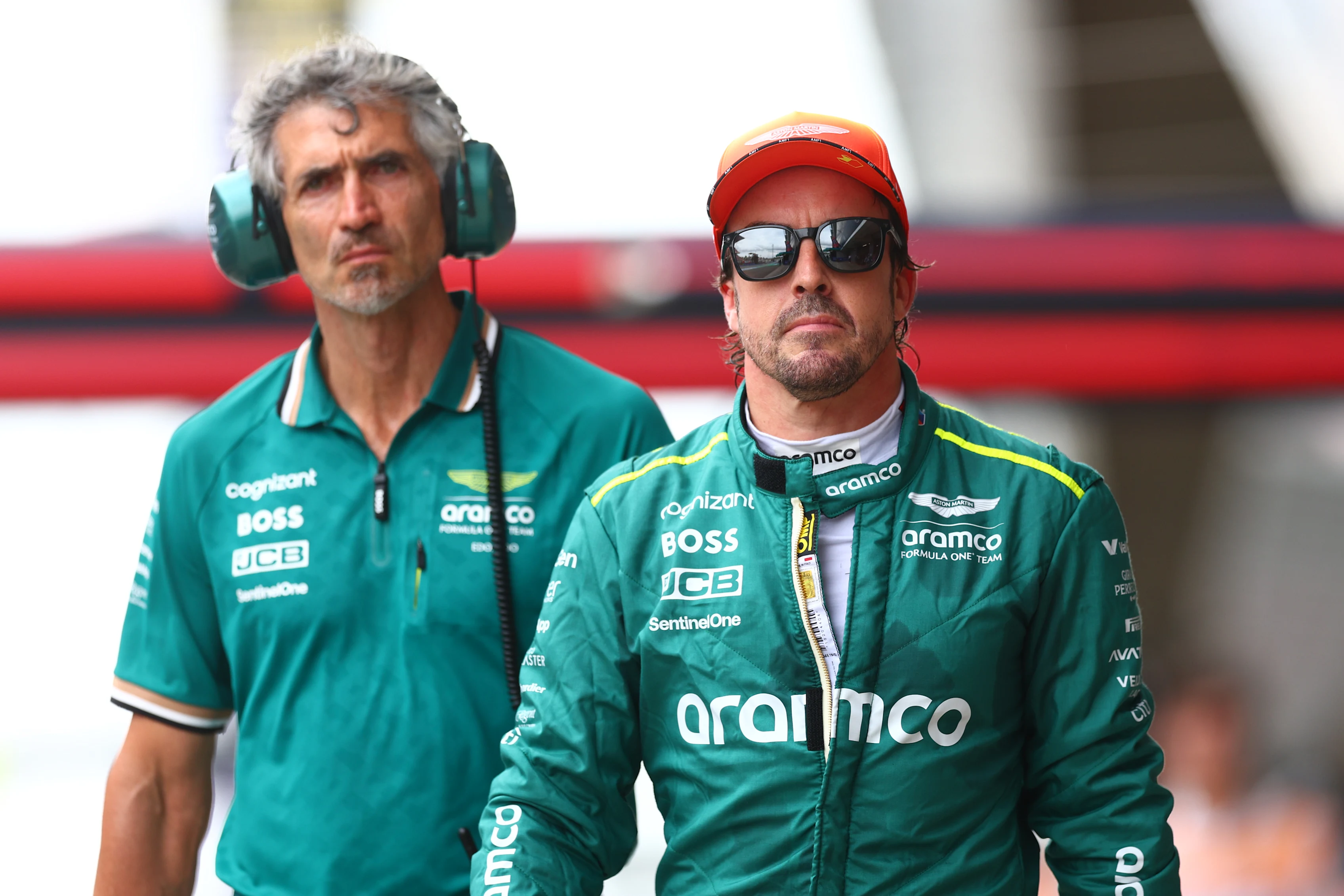 BARCELONA, SPAIN - JUNE 22: 11th placed qualifier Fernando Alonso of Spain and Aston Martin F1 Team walks in the Pitlane during qualifying ahead of the F1 Grand Prix of Spain at Circuit de Barcelona-Catalunya on June 22, 2024 in Barcelona, Spain. (Photo by Clive Rose - Formula 1/Formula 1 via Getty Images)