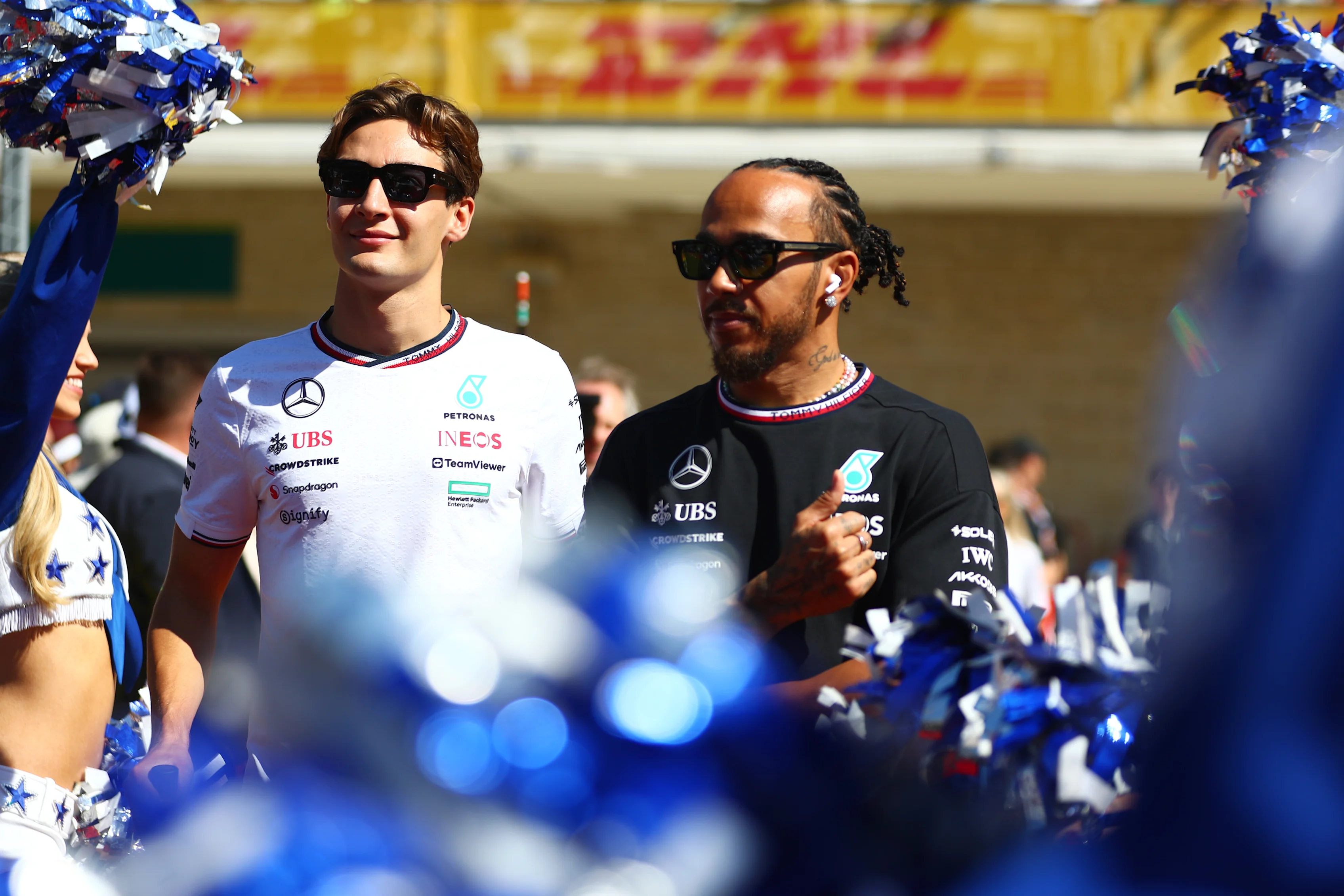 AUSTIN, TEXAS - OCTOBER 20: George Russell of Great Britain and Mercedes and Lewis Hamilton of Great Britain and Mercedes look on from the drivers parade prior to the F1 Grand Prix of United States at Circuit of The Americas on October 20, 2024 in Austin, Texas. (Photo by Peter Fox - Formula 1/Formula 1 via Getty Images)