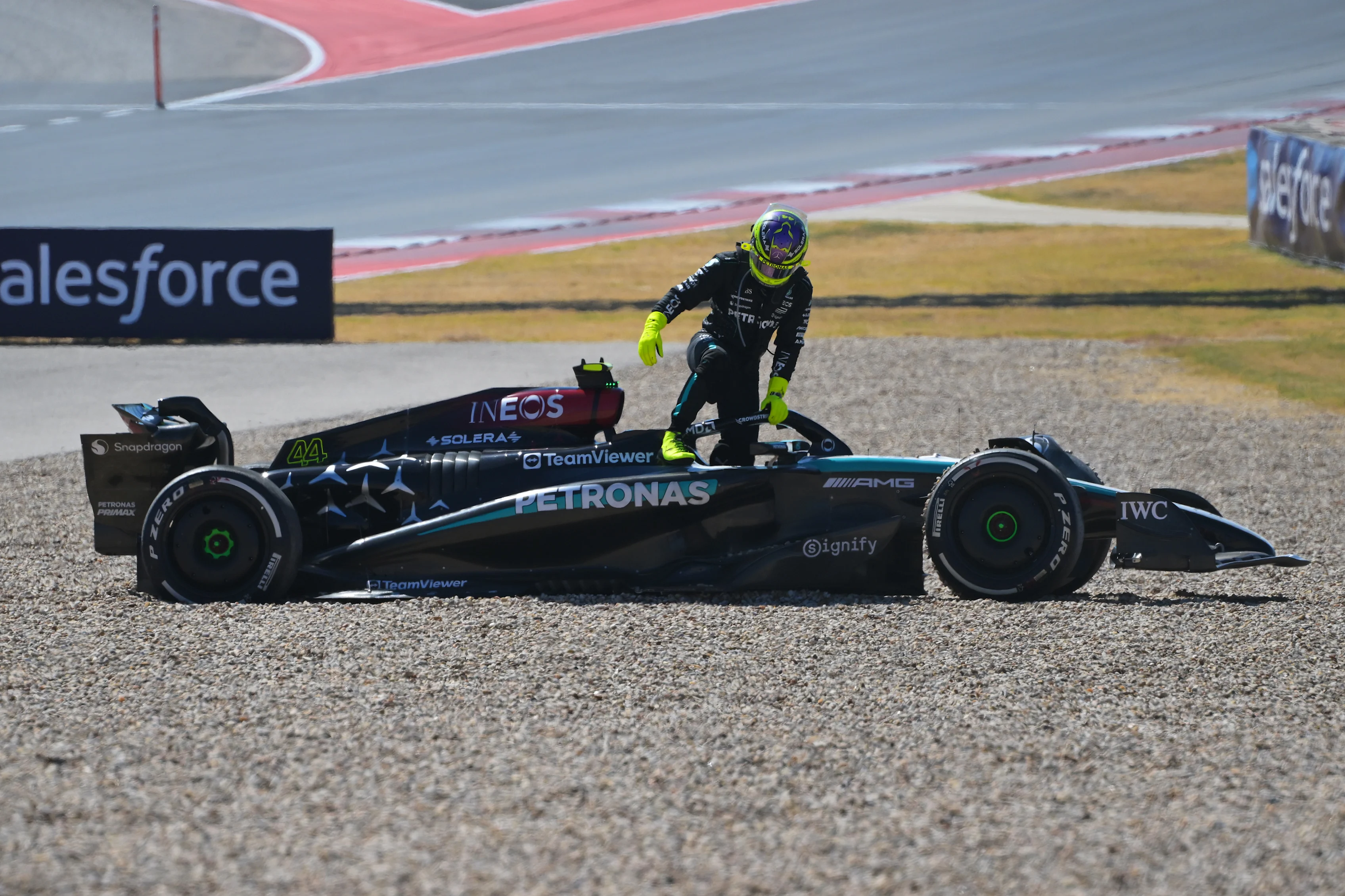 AUSTIN, TEXAS - OCTOBER 20: Lewis Hamilton of Great Britain and Mercedes climbs from his car to retire from the race during the F1 Grand Prix of United States at Circuit of The Americas on October 20, 2024 in Austin. (Photo by Mark Sutton/Getty Images)