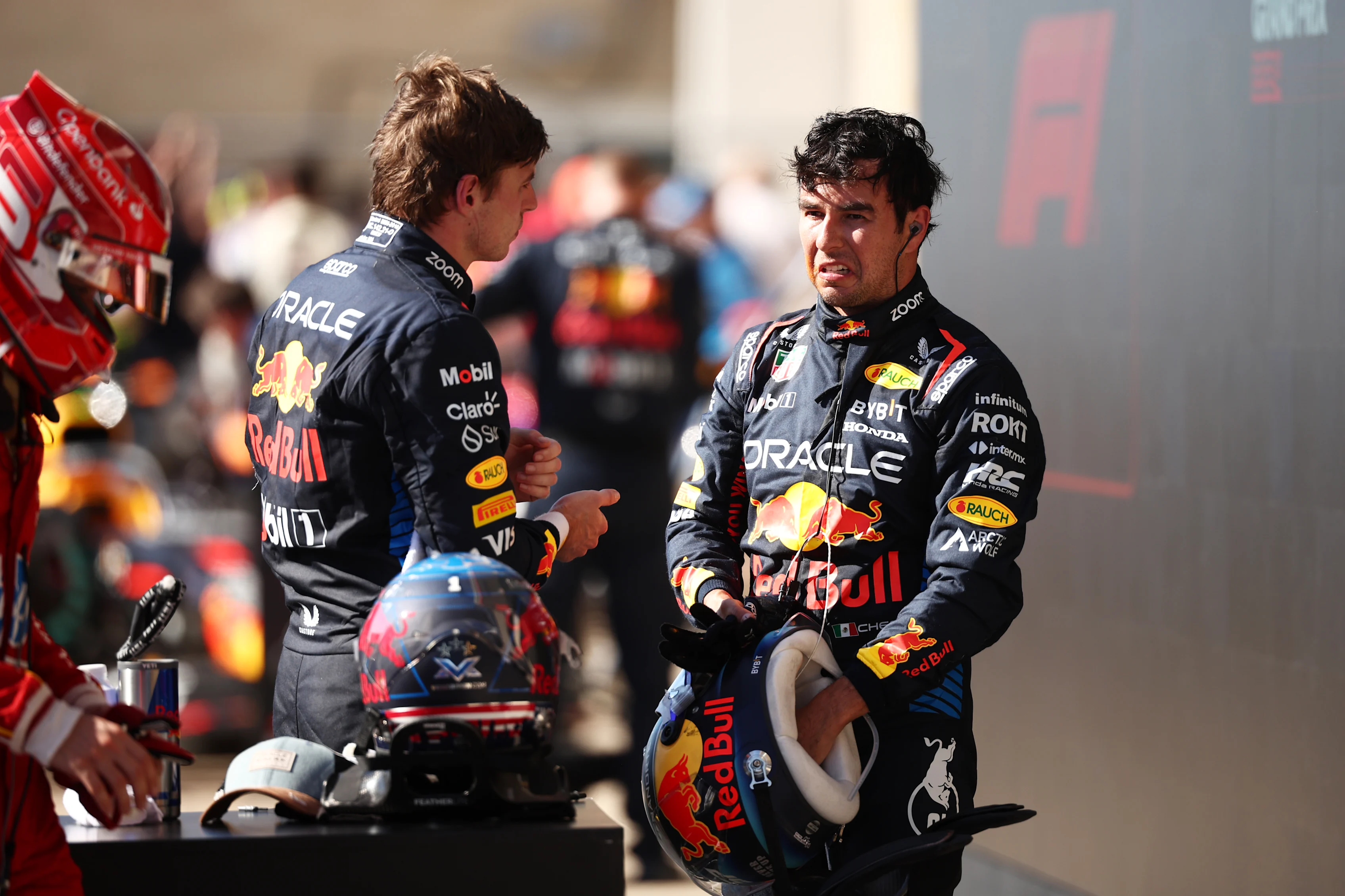 AUSTIN, TEXAS - OCTOBER 20: Third placed Max Verstappen of the Netherlands and Oracle Red Bull Racing and 7th placed Sergio Perez of Mexico and Oracle Red Bull Racing talk in parc ferme during the F1 Grand Prix of United States at Circuit of The Americas on October 20, 2024 in Austin, Texas. (Photo by Jared C. Tilton/Getty Images)