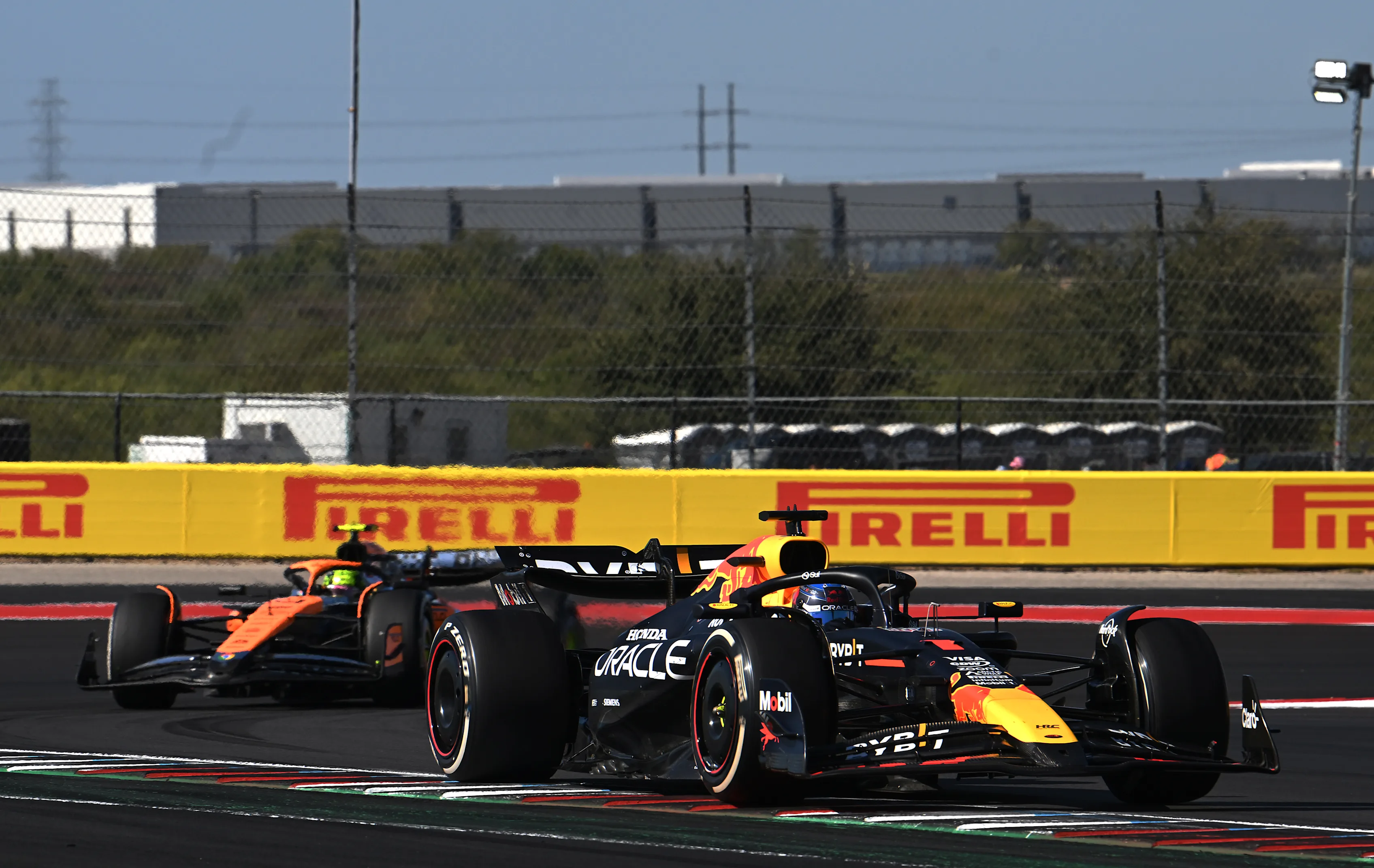 AUSTIN, TEXAS - OCTOBER 20: Max Verstappen driving the (1) Oracle Red Bull Racing RB20 leads Lando Norris driving the (4) McLaren MCL38 Mercedes on track during the F1 Grand Prix of United States. (Photo by Mark Sutton/Getty Images)