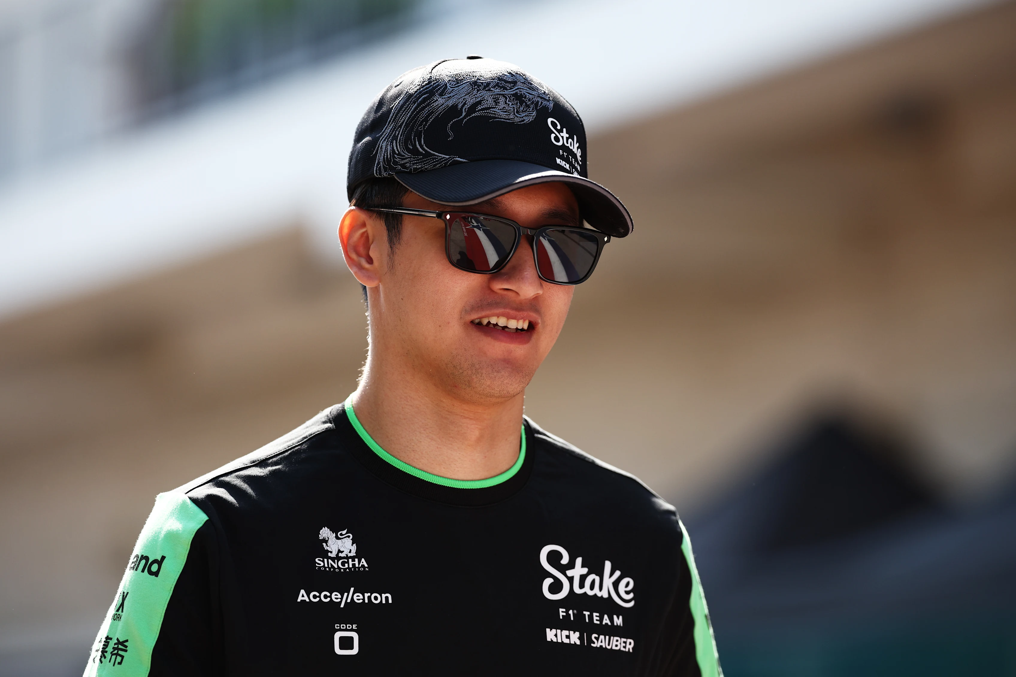 AUSTIN, TEXAS - OCTOBER 17: Zhou Guanyu of China and Stake F1 Team Kick Sauber walks in the Paddock