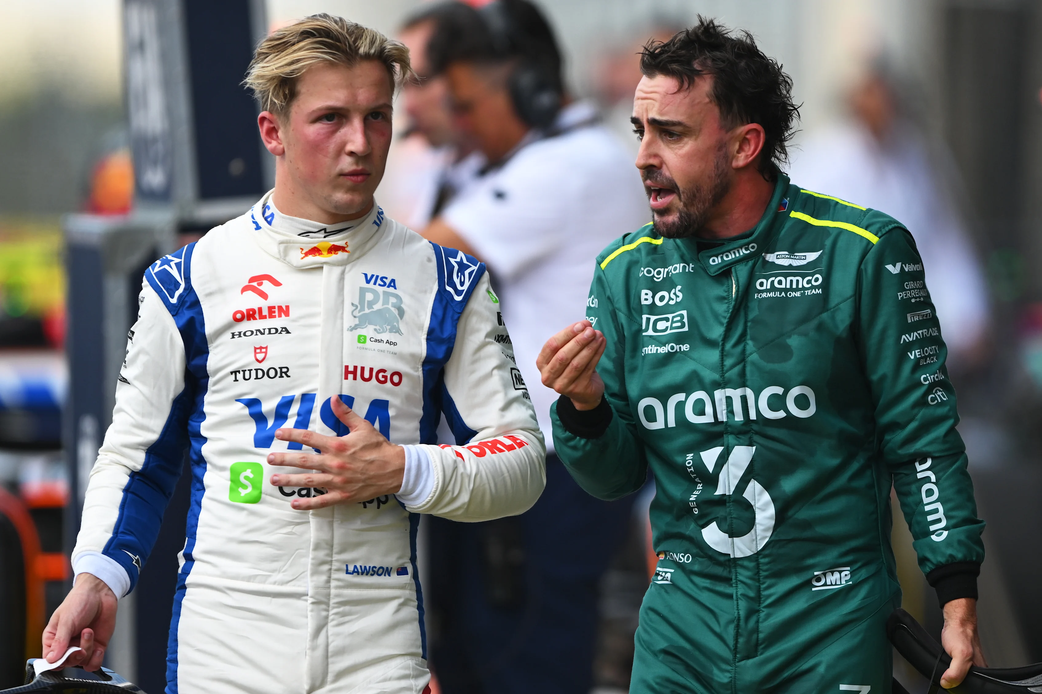AUSTIN, TEXAS - OCTOBER 19: 16th placed Liam Lawson and 18th placed Fernando Alonso talk in parc ferme during the Sprint ahead of the F1 Grand Prix of United States at Circuit of The Americas on October 19, 2024. (Photo by Rudy Carezzevoli/Getty Images)