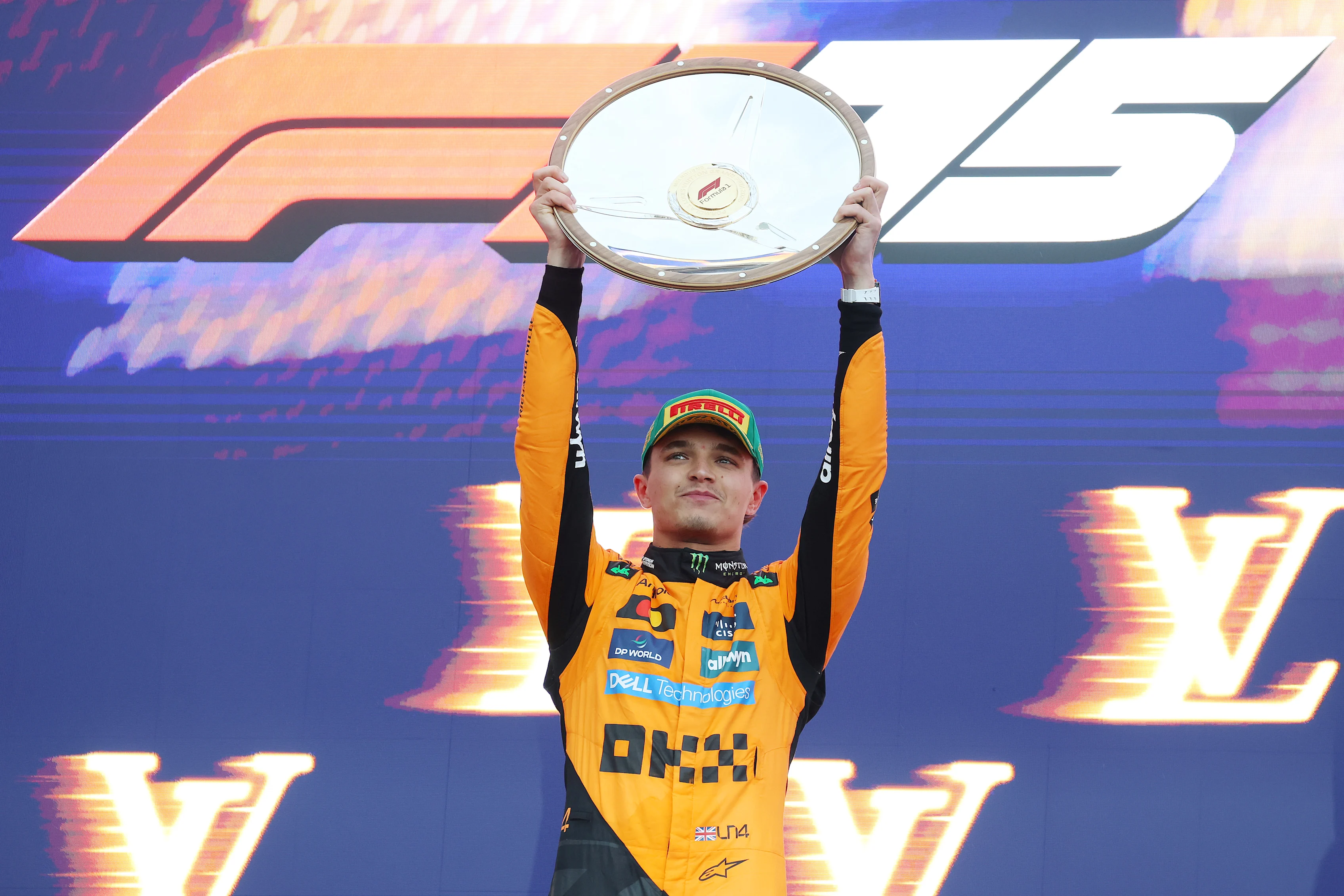 MELBOURNE, AUSTRALIA - MARCH 16: Race winner Lando Norris of Great Britain and McLaren lifts his trophy on the podium during the F1 Grand Prix of Australia at Albert Park Grand Prix Circuit on March 16, 2025 in Melbourne, Australia. (Photo by Mark Thompson/Getty Images)