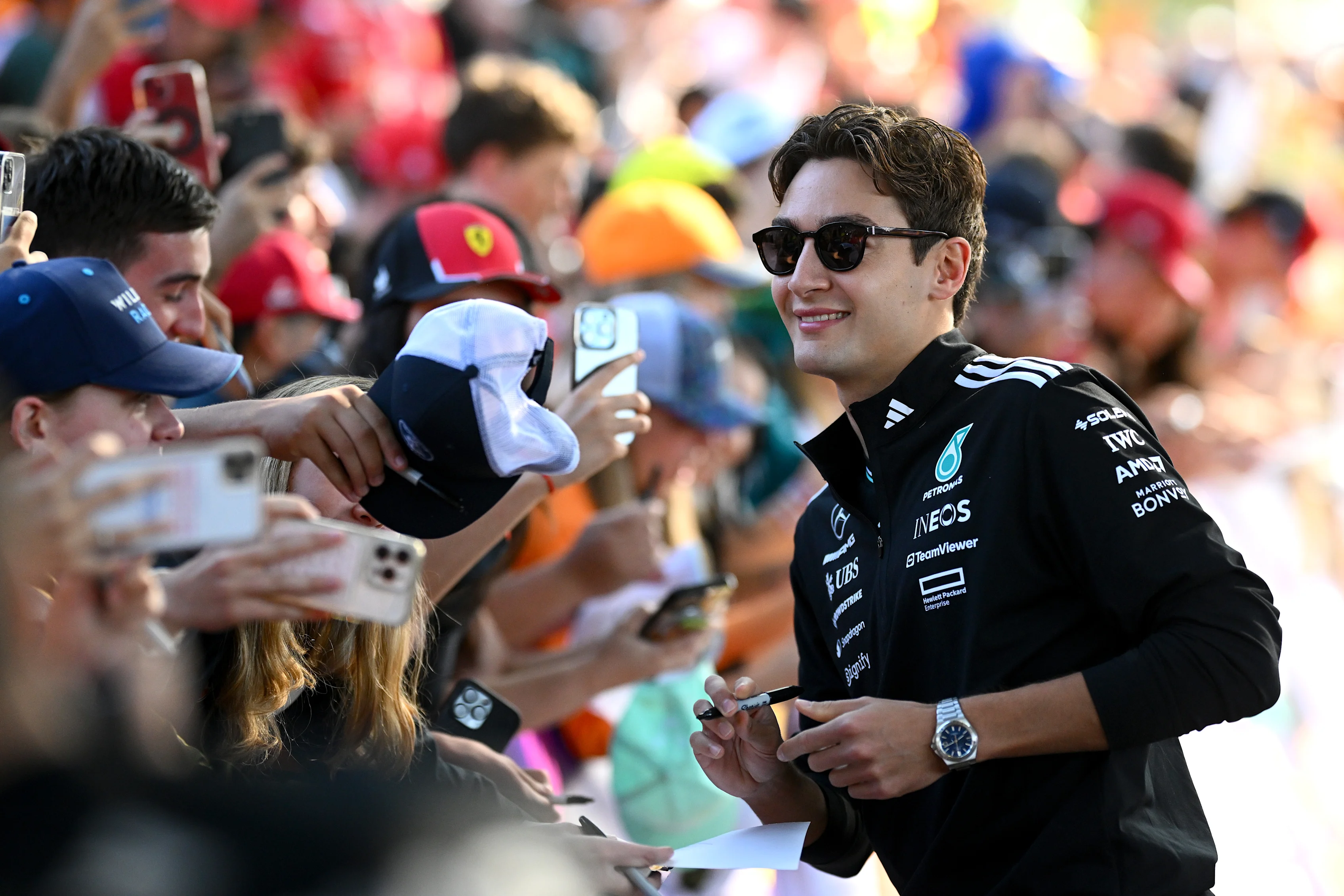 MELBOURNE, AUSTRALIA - MARCH 14: George Russell of Great Britain and Mercedes AMG Petronas F1 Team meets some fans prior to practice ahead of the F1 Grand Prix of Australia at Albert Park Grand Prix Circuit on March 14, 2025 in Melbourne, Australia. (Photo by Clive Mason/Getty Images)