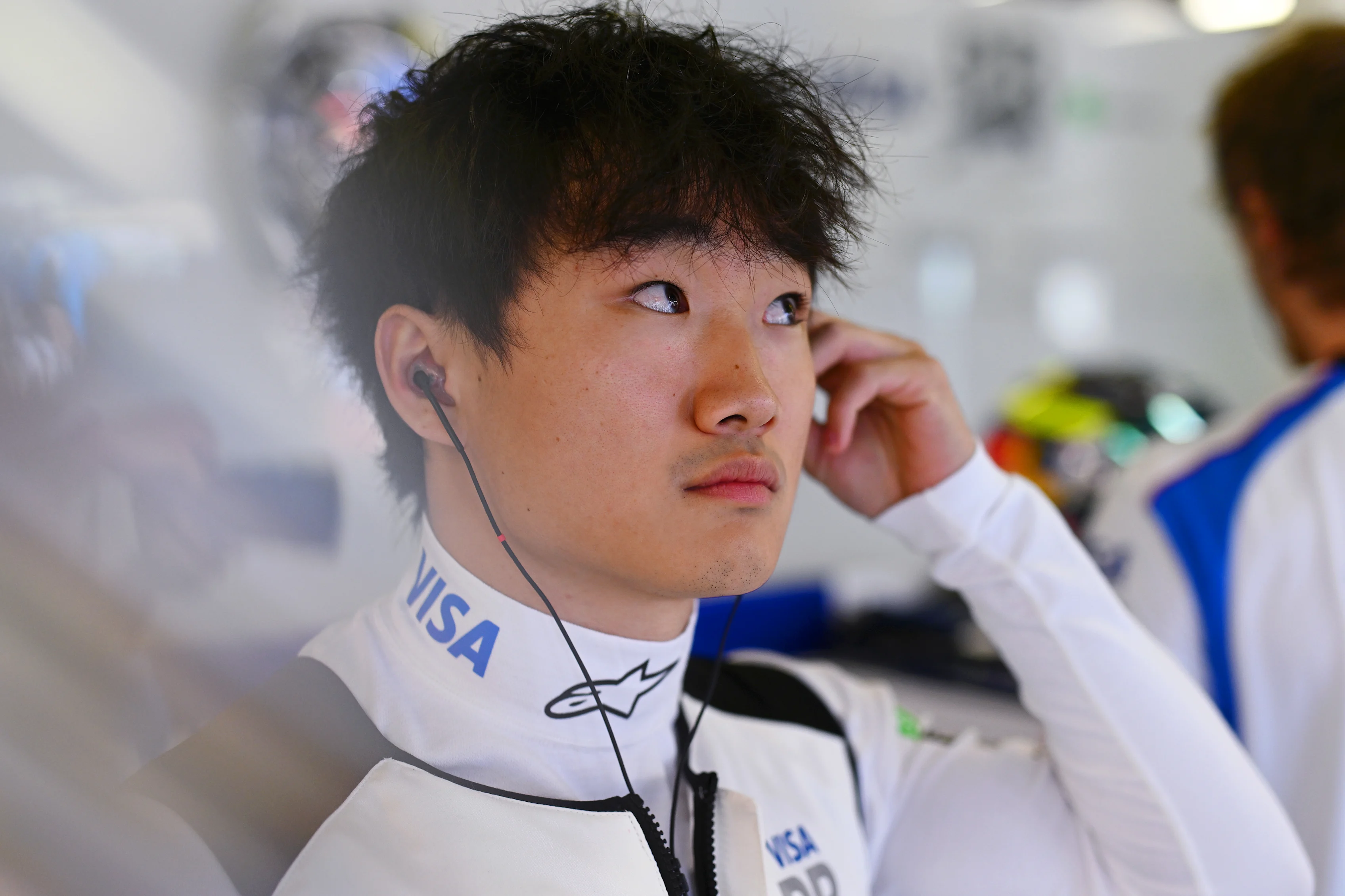 MELBOURNE, AUSTRALIA - MARCH 14: Yuki Tsunoda of Japan and Visa Cash App Racing Bulls looks on in the garage during practice ahead of the F1 Grand Prix of Australia at Albert Park Grand Prix Circuit on March 14, 2025 in Melbourne, Australia. (Photo by Rudy Carezzevoli/Getty Images)