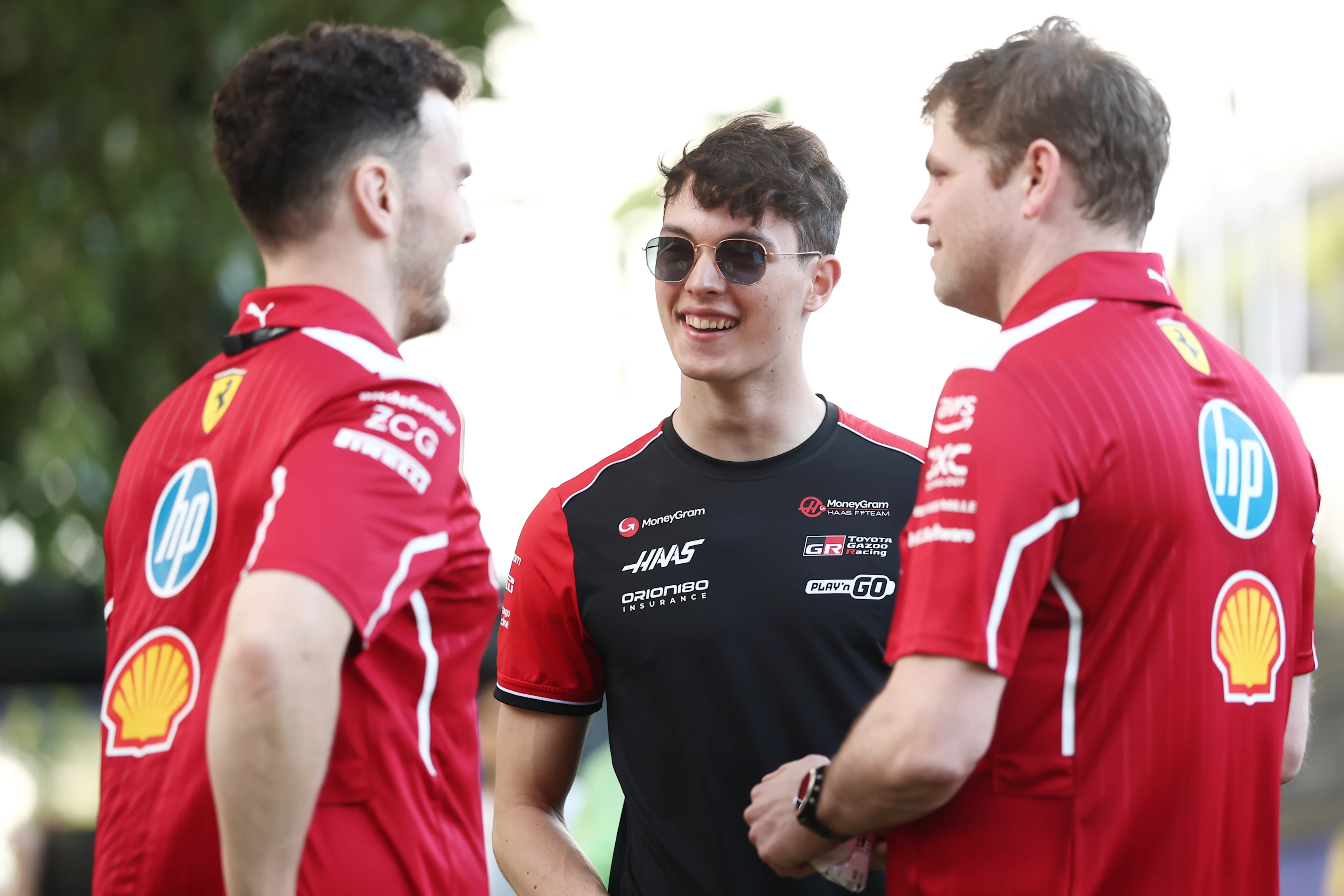MELBOURNE, AUSTRALIA - MARCH 12: Oliver Bearman of Great Britain and Haas F1 talks with Scuderia