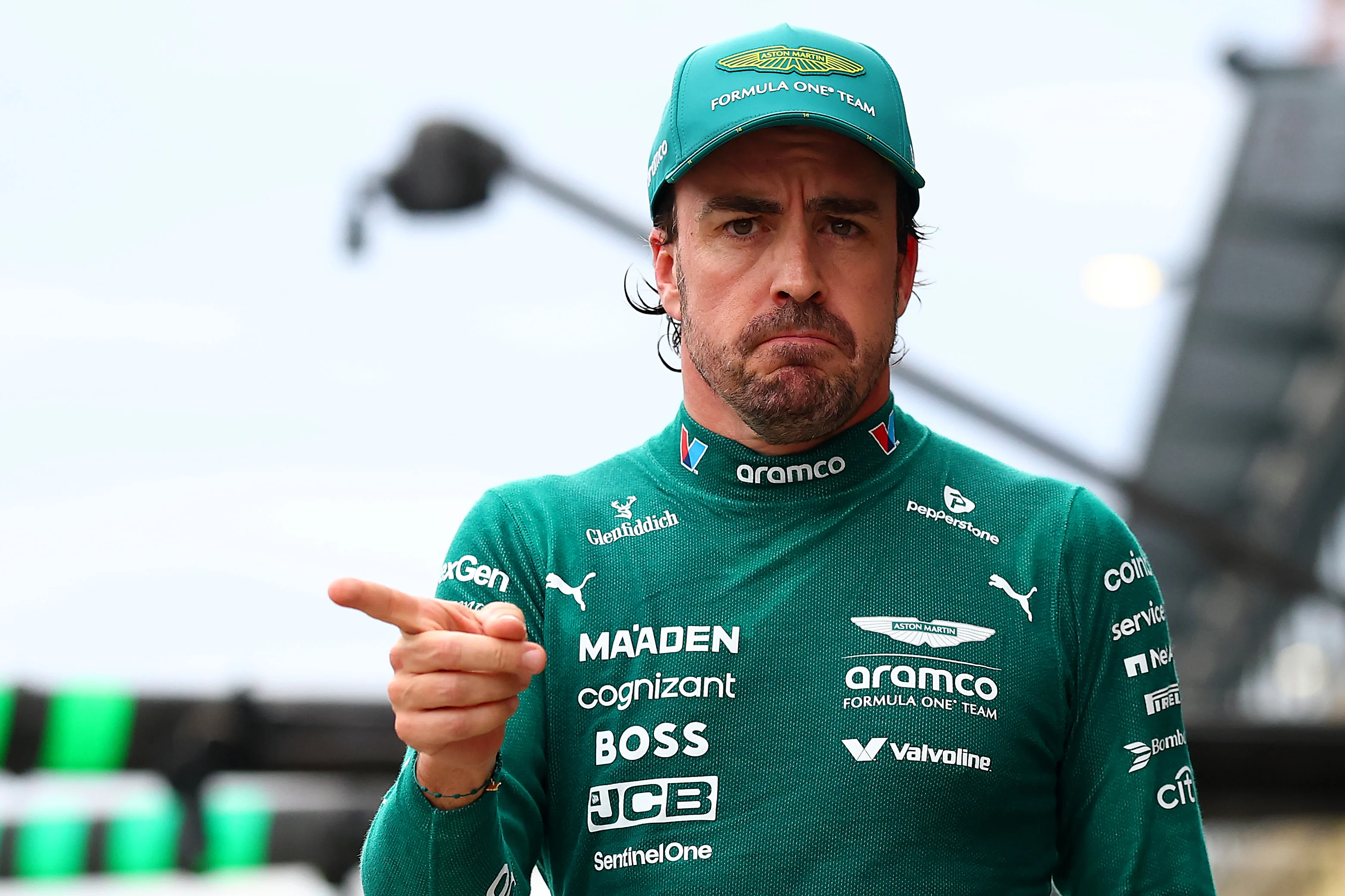 MELBOURNE, AUSTRALIA - MARCH 15: Twelth placed qualifier Fernando Alonso of Spain and Aston Martin F1 Team looks on in the Pitlane during qualifying ahead of the F1 Grand Prix of Australia at Albert Park Grand Prix Circuit on March 15, 2025 in Melbourne, Australia. (Photo by Bryn Lennon - Formula 1/Formula 1 via Getty Images)