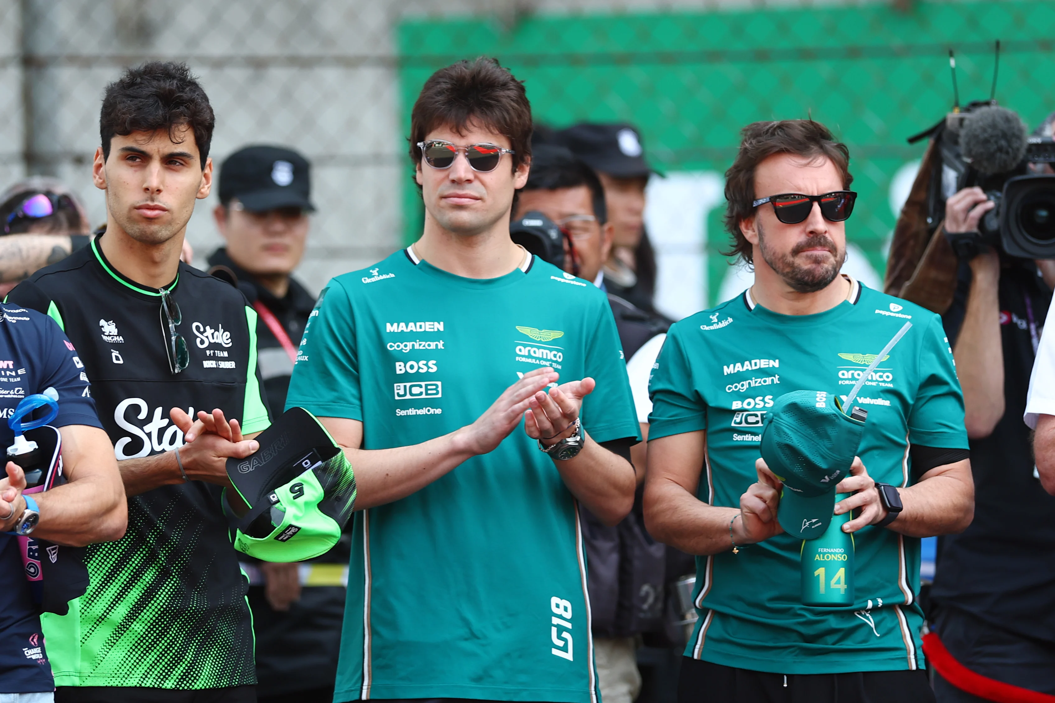 SHANGHAI, CHINA - MARCH 23: Gabriel Bortoleto of Brazil and Stake F1 Team Kick Sauber Lance Stroll of Canada and Aston Martin F1 Team and Fernando Alonso of Spain and Aston Martin F1 Team at the tribute to the late Eddie Jordan prior to the F1 Grand Prix of China at Shanghai International Circuit on March 23, 2025 in Shanghai, China. (Photo by Bryn Lennon - Formula 1/Formula 1 via Getty Images)