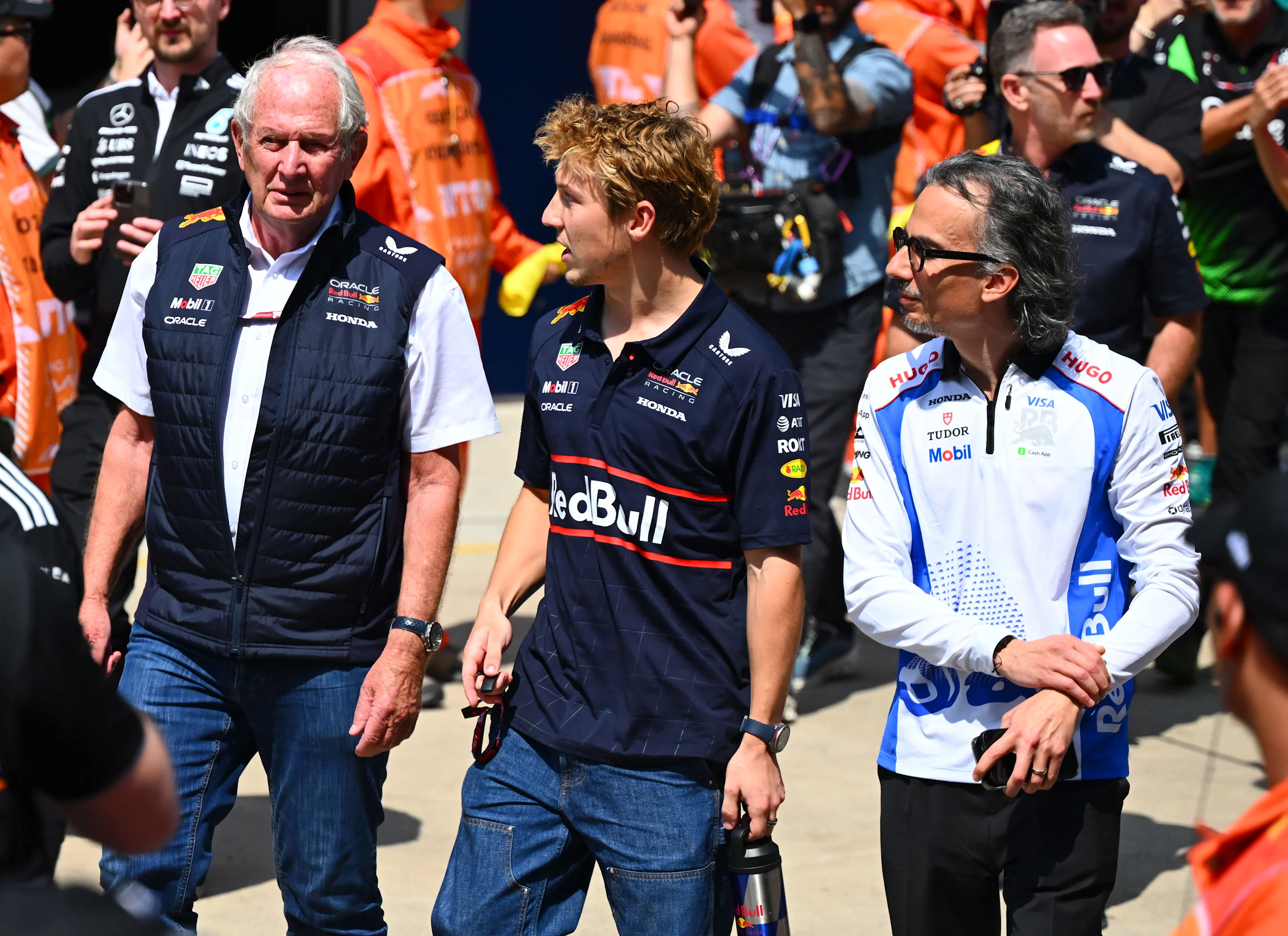 Dr Helmut Marko, Liam Lawson, and Laurent Mekies talk after the tribute to the late Eddie Jordan at Shanghai International Circuit on March 23, 2025 in Shanghai, China. (Photo by Mark Sutton - Formula 1/Formula 1 via Getty Images)