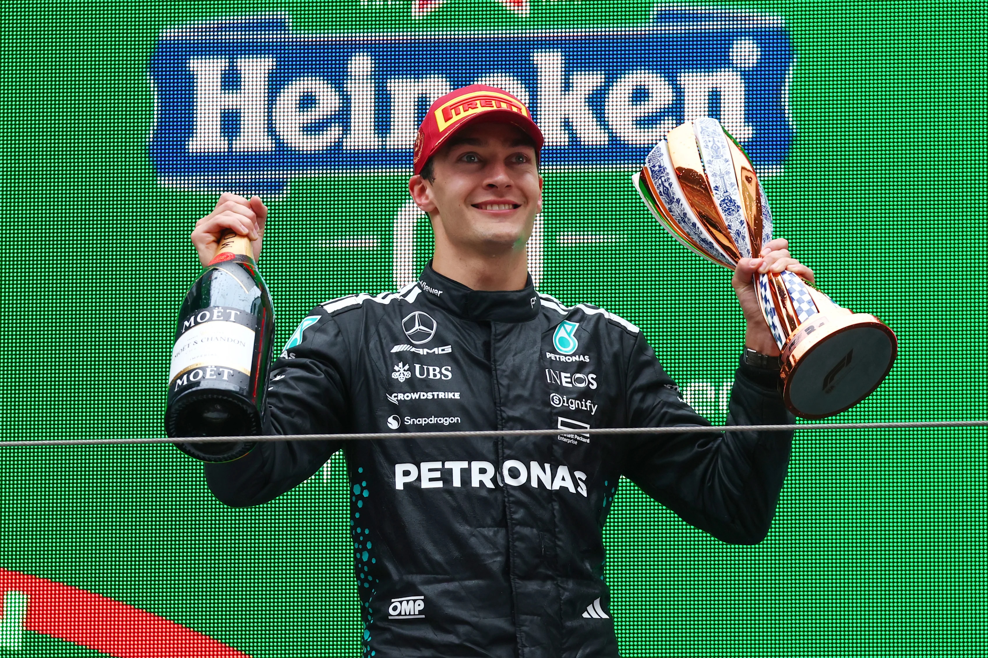 SHANGHAI, CHINA - MARCH 23: Third placed George Russell of Great Britain and Mercedes AMG Petronas F1 Team on the podium with his trophy during the F1 Grand Prix of China at Shanghai International Circuit on March 23, 2025 in Shanghai, China. (Photo by Clive Rose/Getty Images)