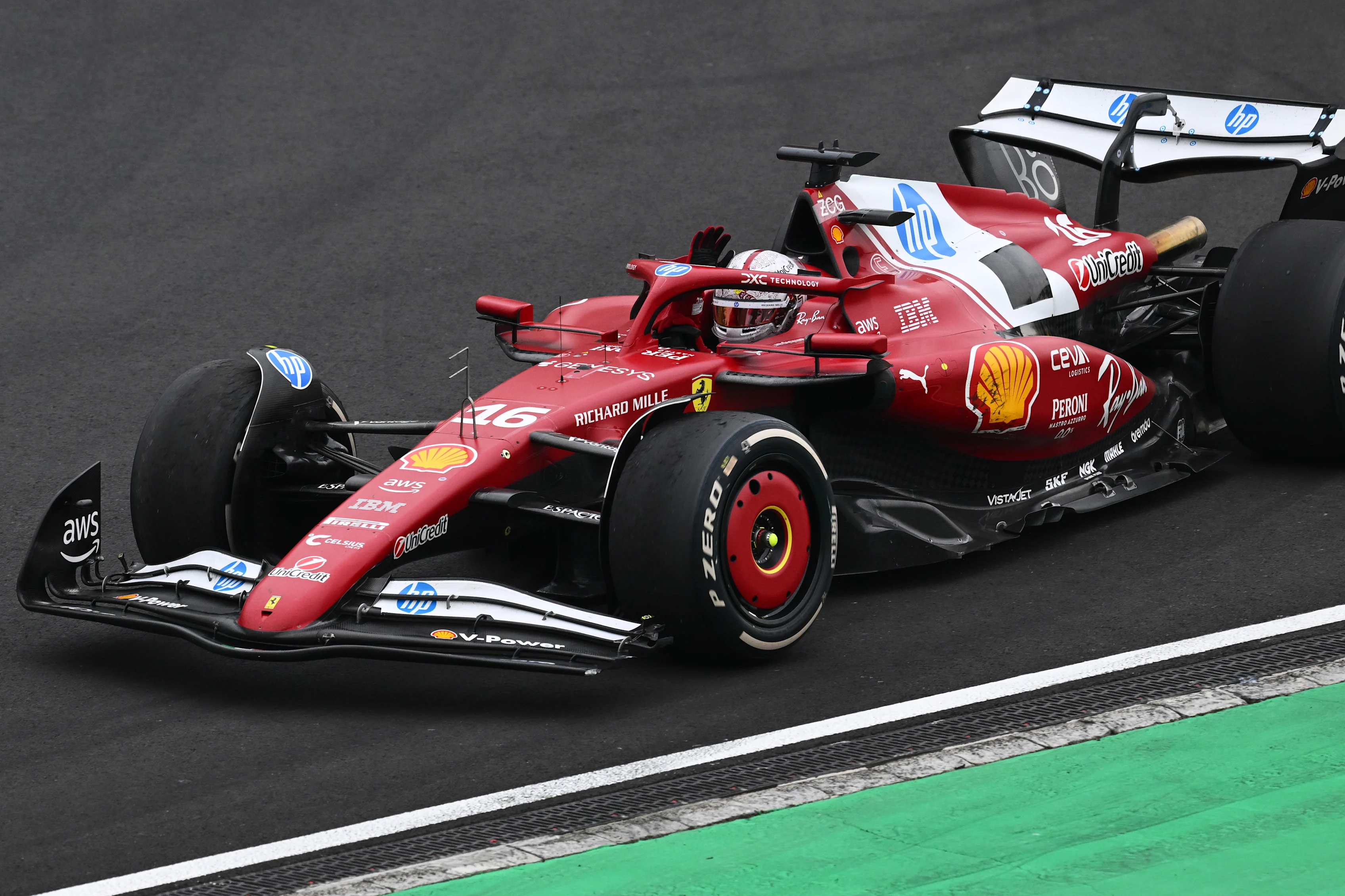 SHANGHAI, CHINA - MARCH 23: Charles Leclerc of Monaco driving the (16) Scuderia Ferrari SF-25 waves to fans on his way to parc ferme during the F1 Grand Prix of China at Shanghai International Circuit on March 23, 2025 in Shanghai, China. (Photo by Clive Mason/Getty Images)