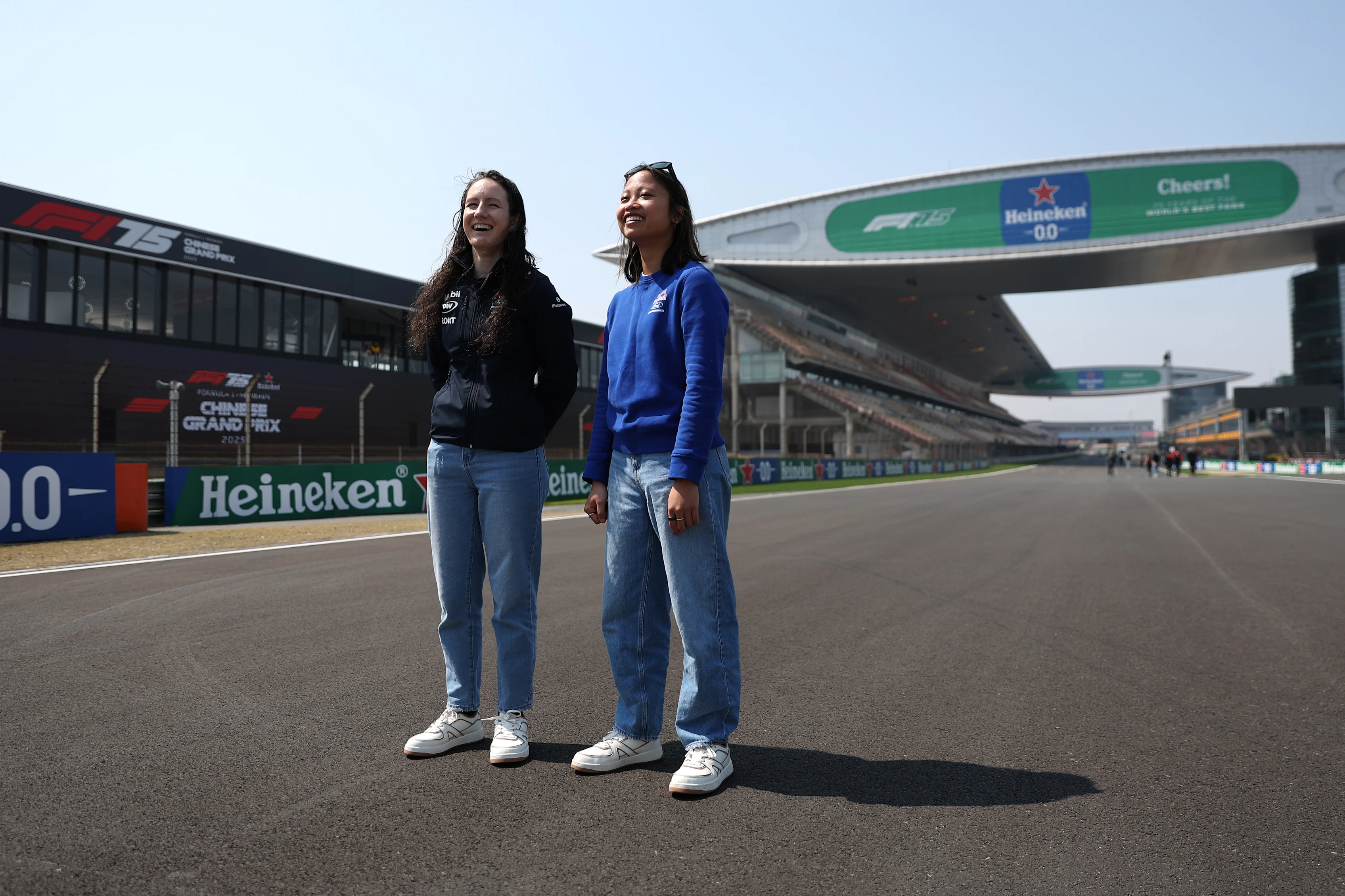 Alisha Palmowski of Campos Racing (21) with Chloe Chambers of Campos Racing (14) during previews ahead of the F1 Grand Prix of China at Shanghai International Circuit on March 20, 2025 in Shanghai, China. (Photo by Meg Oliphant/Getty Images)